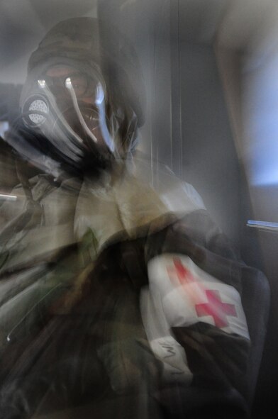 ELLSWORTH AIR FORCE BASE, S.D. -- Lt. Col. David Roll, 28th Medical Operations Squadron commander, takes shelter during a Phase II Operational Readiness Exercise, March 2.  The Phase II ORE is designed to simulate a deployed environment and test the combat abilities of Ellsworth's Airmen. (U.S. Air Force photo/Airman 1st Class Anthony Sanchelli)
