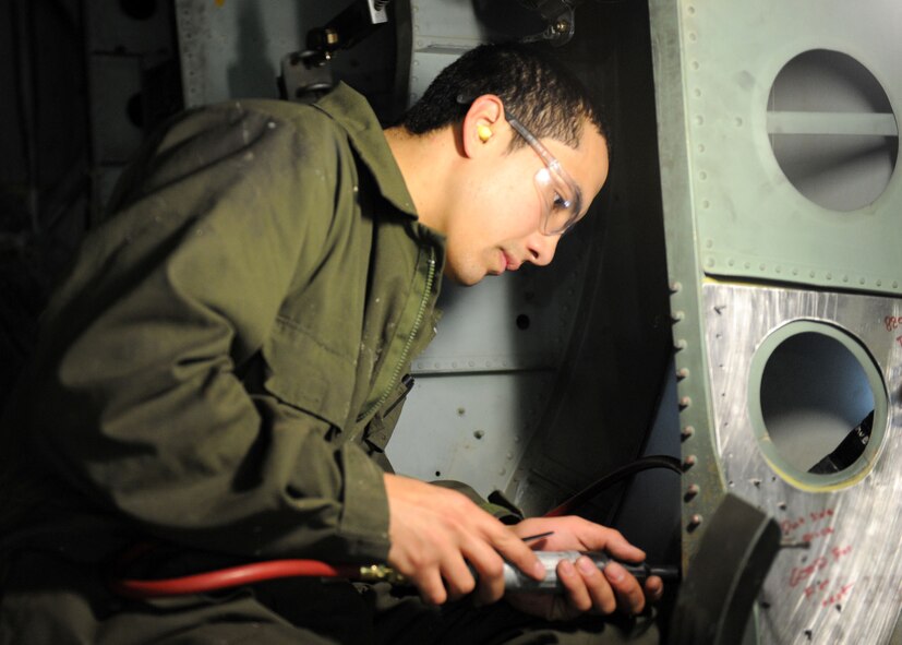 DYESS AIR FORCE BASE, Texas – Senior Airman Benjamin Brown, a sheet medalist from the 7th Equipment Maintenance Squadron, replaces a cracked bulkhead on a C-130 Hercules aircraft during an inspection here March 2. Inspections are performed before and after flights to insure there is nothing wrong with the aircraft. (U.S. Air Force photo/Airman First Class Brittney Prescott)