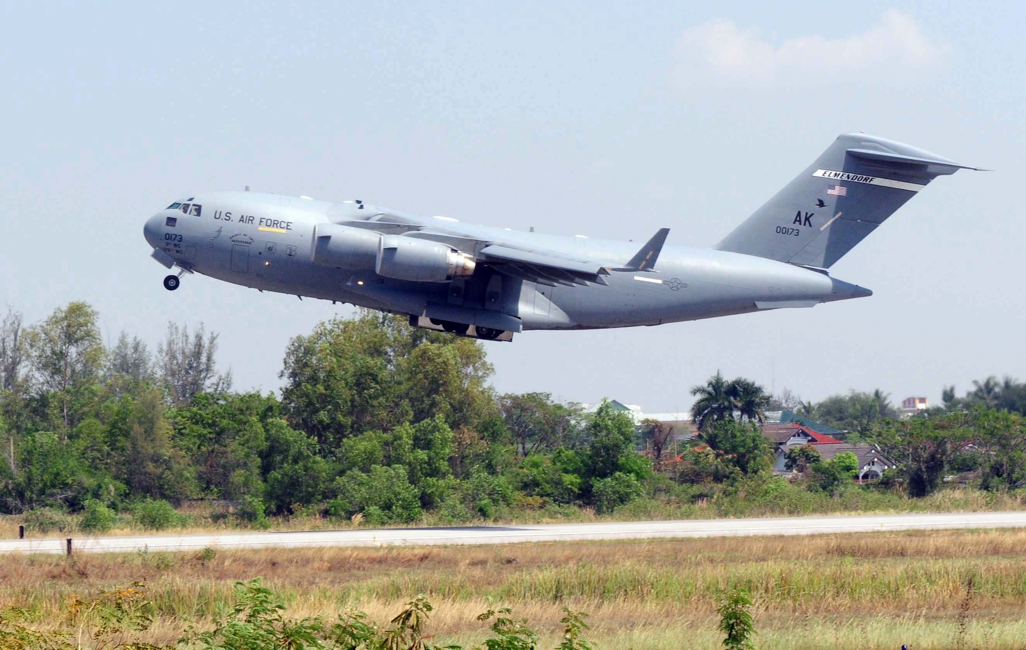 A C-17 Globemaster III from the 3rd Wing at Elmendorf Air Force Base, Alaska, departs Udon Thani Royal Thai Air Force Base, Thailand, for a low-level airdrop March 1 as part of Cope Tiger 2010. (U.S. Air Force photo/Capt. Genieve David)