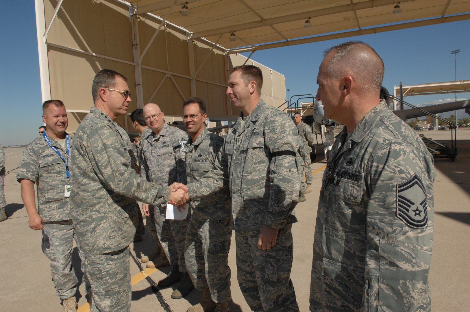Air Combat Command Commander, Gen. William Fraser III, greets Capt. Kevin Koren, 355th Equipment Maintenance Squadron, and other Airmen on the flight line during his tour of Davis-Monthan Air Force Base Feb. 23. During his tour, General Fraser visited the 355th Operations Group, the 55th Electronic Combat Group, the 563d Rescue Group, the dining facility, the fitness center and spoke to D-M Airmen at an all call at the base theater. (U.S. Air Force photo/Staff Sgt. Alesia Goosic)