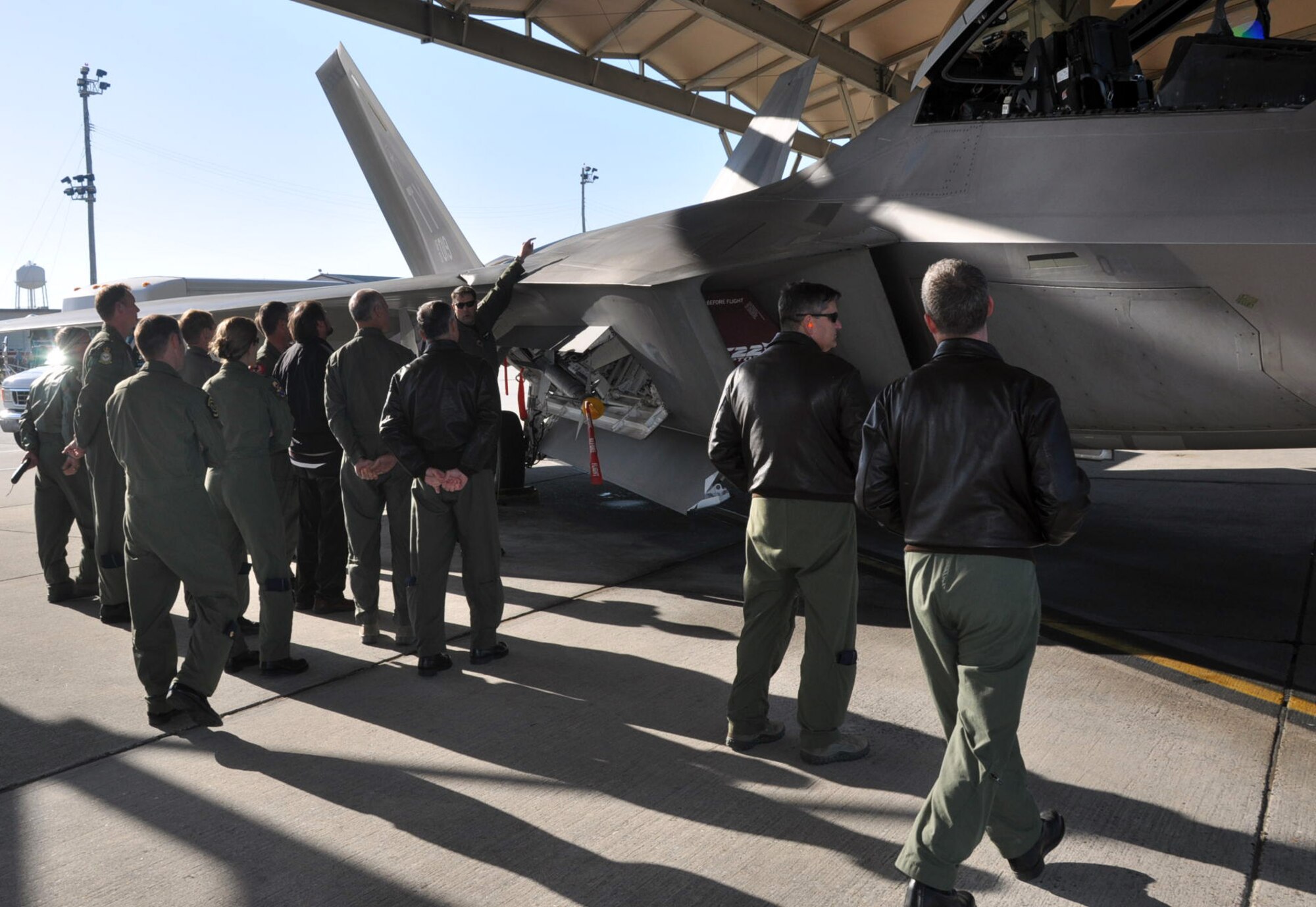 Lt. Col. Brad Bird, 43rd Fighter Squadron Director of Operations, briefs the pilot physicians on the F-22 Feb. 16 on the Tyndall flight line. (U.S. Air Force photo by Airman 1st Class Rachelle Elsea)