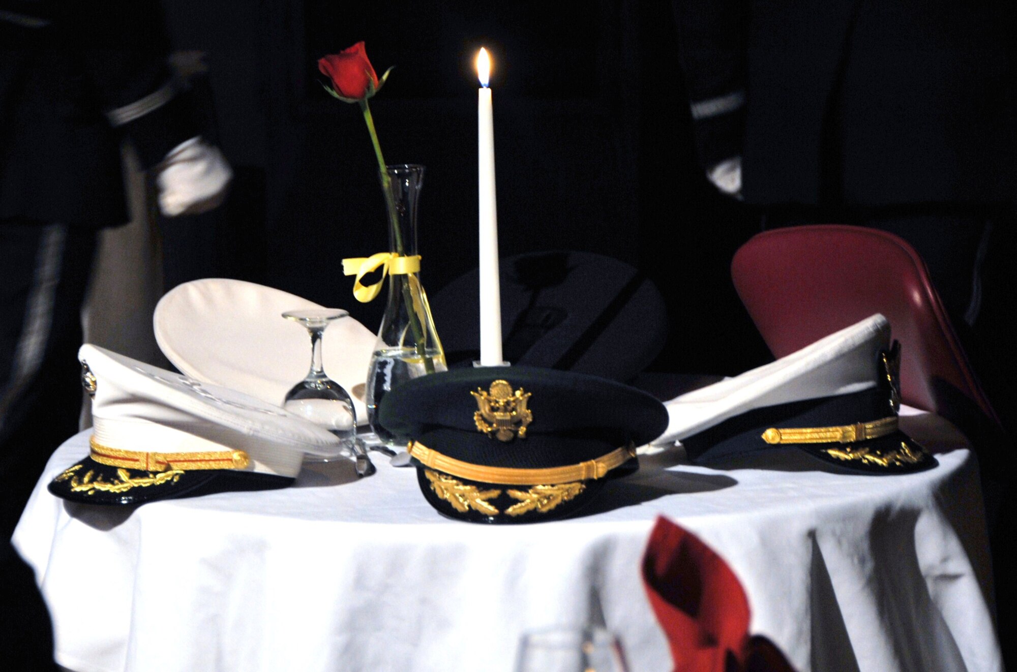 OFFUTT AIR FORCE BASE, Neb. - A table honoring those who are missing in action or prisoners of war sits on display at the Patriot Club here Feb. 26 during the 55th Wing Annual Awards Banquet. The table was part of the POW/MIA ceremony, a ceremony held at many Air Force functions to honor all servicemembers who never made it home. U.S. Air Force photo by D.P. Heard