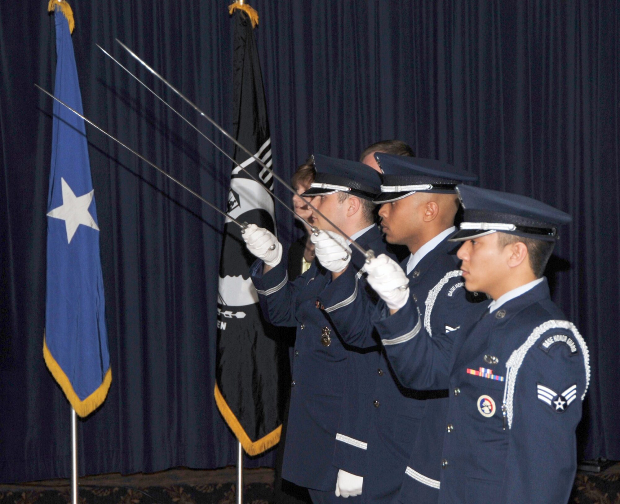 OFFUTT AIR FOCE BASE, Neb. - Members of the Offutt Honor Guard, raise their sabers to form a saber cordon, which all award nominees walked under as they were introduced at the 55th Wing Annual Awards Banquet at the Patriot Club here Feb. 26. U.S. Air Force photo by D.P. Heard
