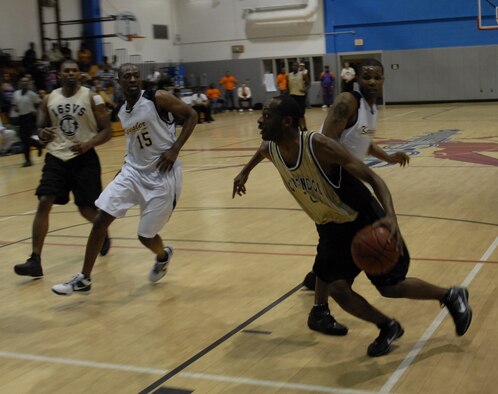 Damien Fantroy, Hurlburt Field Air Commandos, takes the ball to the goal against the 
Keesler Dragons at the 2010 Southeastern Military Athletic Conference tournament at the Hurlburt Field Aderholt Fitness Center Feb. 28. Hurlburt Field hosted the match after winning the 2009 tournament, and they are now scheduled to host next year’s games. (U.S. Air Force photo by Airman 1st Class Joe McFadden)
