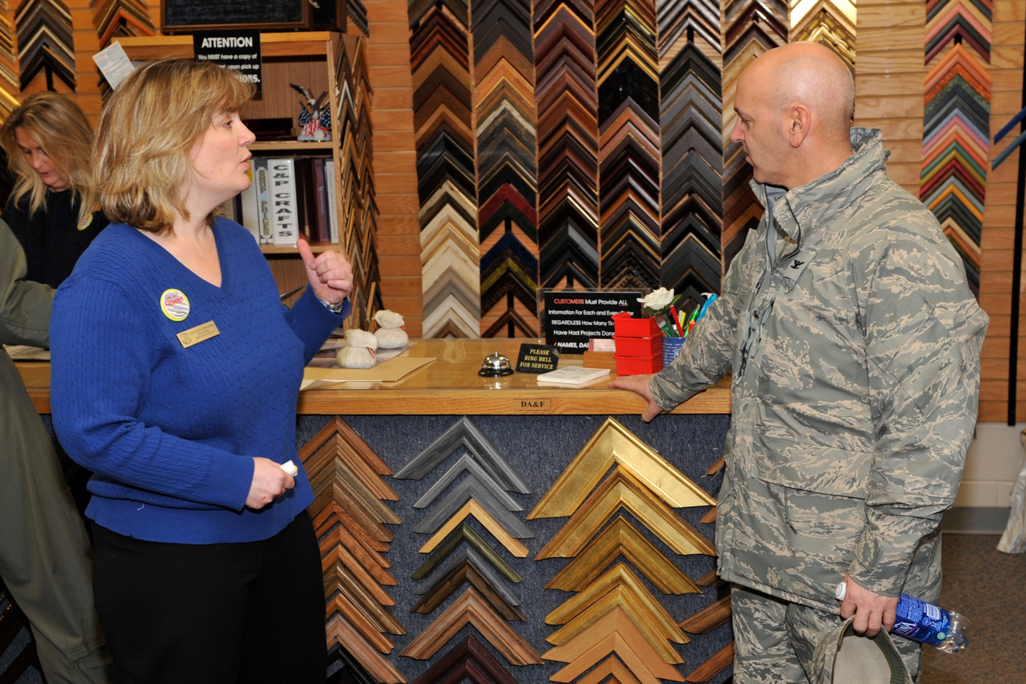 Jane Marie Kopycinski,  Arts and Crafts director, shows Col. Patrick Dunn, Headquarters Air Force Services Agency director of services operation directorate, around the framing shop Jan. 22 for the LeMay evaluation team visit. The 21st Force Support Squadron earned the prestigious Curtis E. LeMay Award, naming the squadron the best service organization in the Air Force, officials announced Feb. 23. The Curtis E. LeMay award is given annually to the best services organization at a base with at least 6,000 personnel. (U.S. Air Force photo/Robb Lingley)