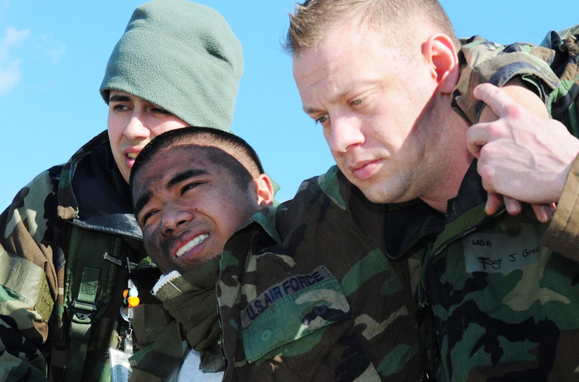 SPANGDAHLEM AIR BASE, Germany – Senior Airman Miguel Marquez, left, and Tech. Sgt. Jason Greene, right, both from the 52nd Component Maintenance Squadron, assist a moulage victim to a vehicle after performing self-aid and buddy care during an exercise scenario on the flightline March 2. The scenario tested capabilities to properly evacuate a building while treating the wounded and providing accountability during Operation Saber Crown 10-05, a Phase II operational readiness exercise. (U.S. Air Force photo/Staff Sgt. Heather Norris)