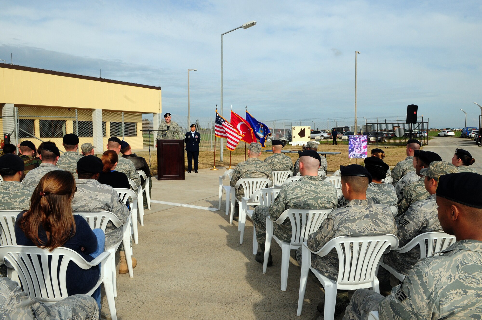 Lt. Col. Glen Christensen, 39th Security Forces Squadron commander, speaks to attendees of a memorial service honoring Ronnie, a fallen 39th SFS MWD Thursday, Feb. 25, 2010 at Incirlik Air Base, Turkey. During the ceremony, Ronnie received an Air Force Commendation Medal for his service, and speakers took turns sharing their experiences with the memorable MWD. (U.S. Air Force Photo/Senior Airman Alex Martinez)