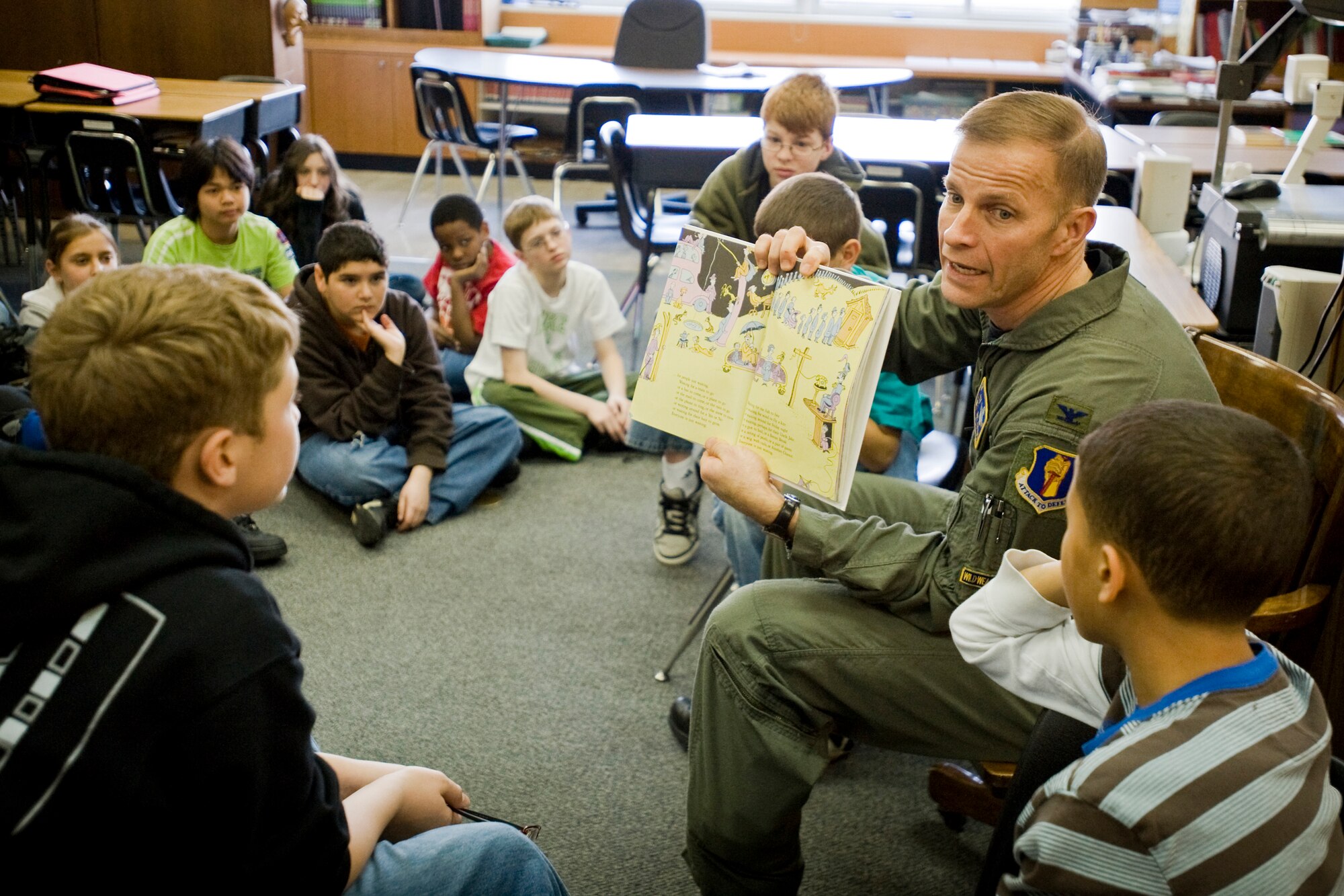MISAWA AIR BASE, Japan -- Col. RC Craig, 35th Fighter Wing vice commander, reads Dr. Seuss' "Oh, The Places You'll Go!" to a class of 6th graders March 2 at Cummings Elementary School. After Colonel Craig read the book, he and the class talked about the book's messages and the lessons to be learned from it. (U.S. Air Force photo/Senior Airman Jamal D. Sutter)