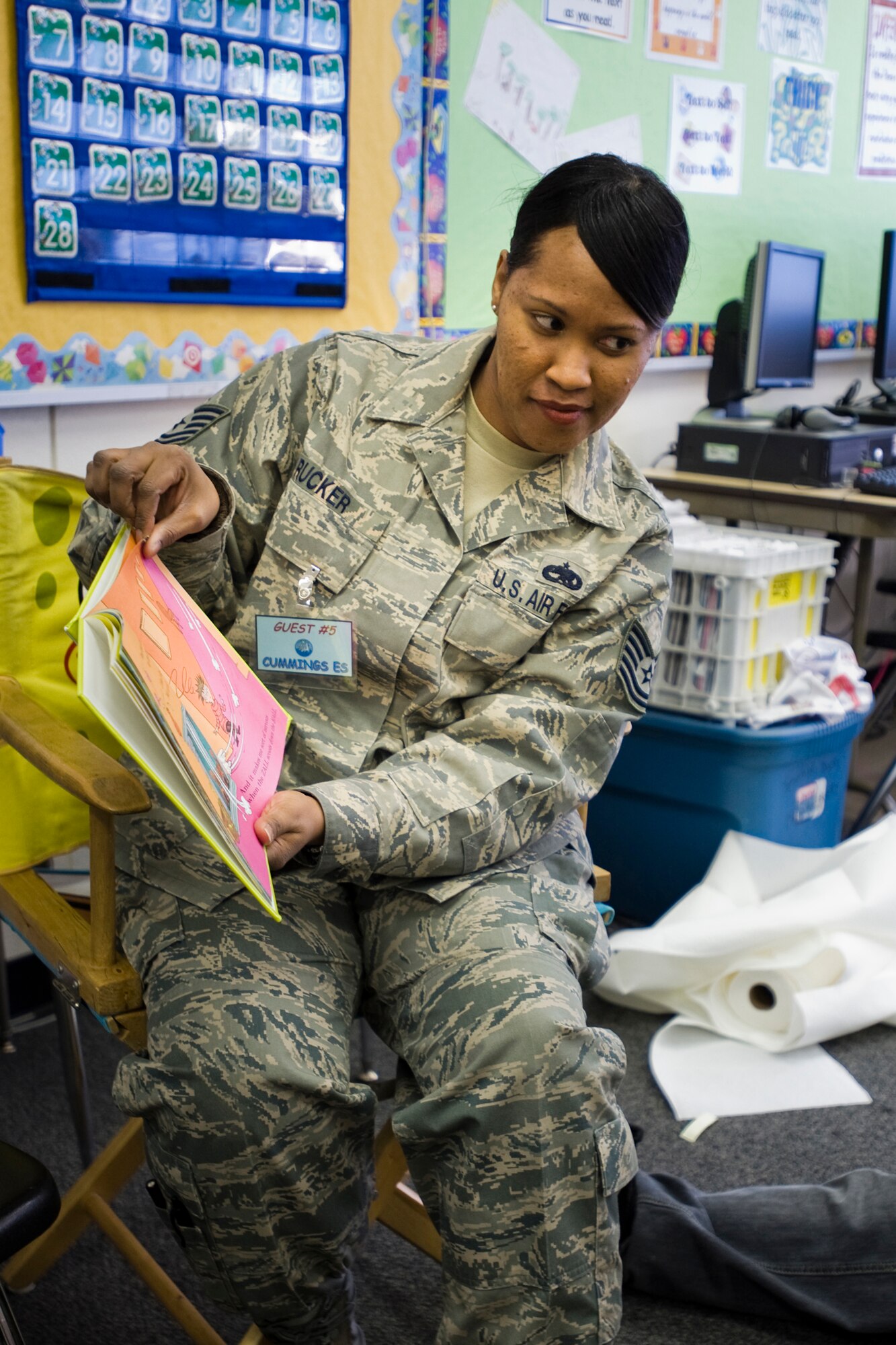 MISAWA AIR BASE, Japan -- Tech. Sgt. Brandy Rucker, 35th Maintenance Squadron non-destructive inspection craftsman, reads Dr. Seuss' "There's a Wocket in my Pocket!" to a class of 4th graders March 2 at Cummings Elementary School. Sergeant Rucker and approximately 40 other volunteers read at the school for the National Education Association's Read Across America program. The program is an annual event that celebrates March 2, the birthday of Dr. Seuss. (U.S. Air Force photo/Senior Airman Jamal D. Sutter)