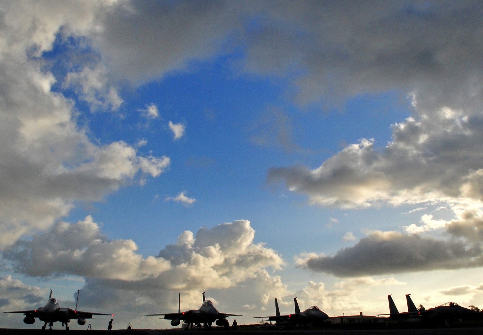 A small group of Airmen from the 67th Aircraft Maintenance Unit ensure F-15 Eagles get one final checkup at the end of runway before take-off Feb. 23. Kadena Airmen participated in joint bilateral training with other U.S. forces and the Japan Air Self Defense Force from Feb. 22-26.The training involved joint planning and the execution of missions in simulated hostile scenarios in development of theater security. (U.S. Air Force photo/Tech. Sgt. Rey Ramon) 
                                                      