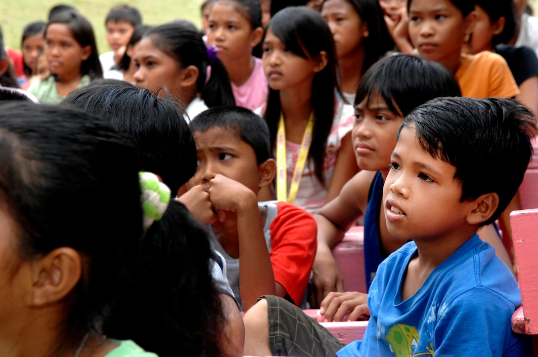 A young boy and his classmates at Francisco L.L. Laya Memorial School ...