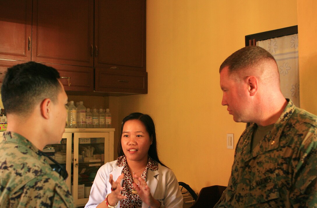 Maj. Peter Forsythe, executive officer for Combat Logistics Battalion 31 (CLB-31), 31st Marine Expeditionary Unit (MEU), and Chief Petty Officer Joshua Rosario, a hospital corpsman, with CLB-31, discuss medical capabilities of the local hospital with Lynn Bueno, a resident physician at Corpuz Clinic and Hospital, during a facility tour, March 4. Marines and sailors with CLB-31 are currently renovating Marnay Primary School in support of Balikatan 2010 (BK ’10). Servicemembers from the Armed Forces of the Philippines (AFP) and the 31st MEU are training together during BK ’10 to hone their civil-military interoperability skills to ensure more responsive, efficient and effective relief efforts.