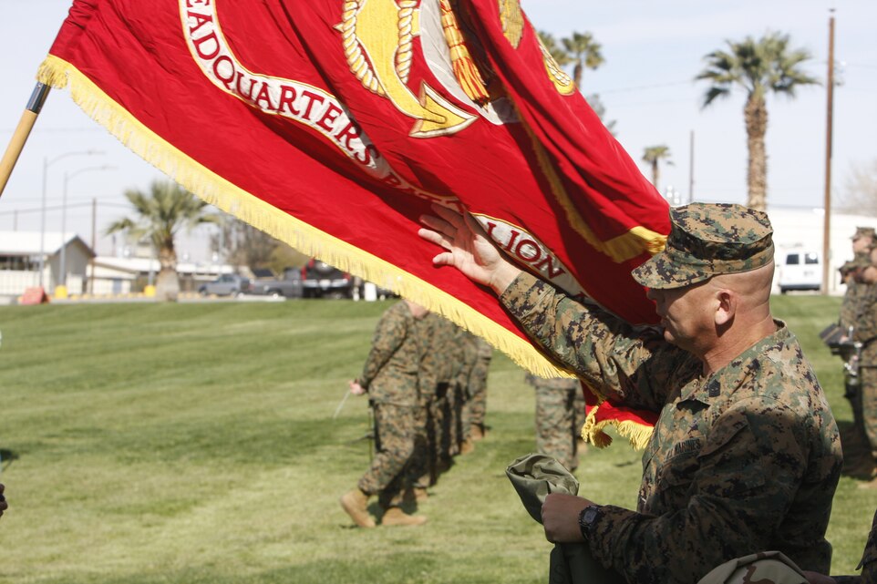 Sgt. Maj. Mark M. Geletko, the retiring Headquarters Battalion sergeant major, inspects the battalion colors March 5 before his post and relief and retirement ceremony with Sgt. Maj. James D. Walsh at the Combat Center's Lance Cpl. Torrey L. Gray Field. Geletko received the Meritorious Service Medal for his service as the battalion sergeant major.