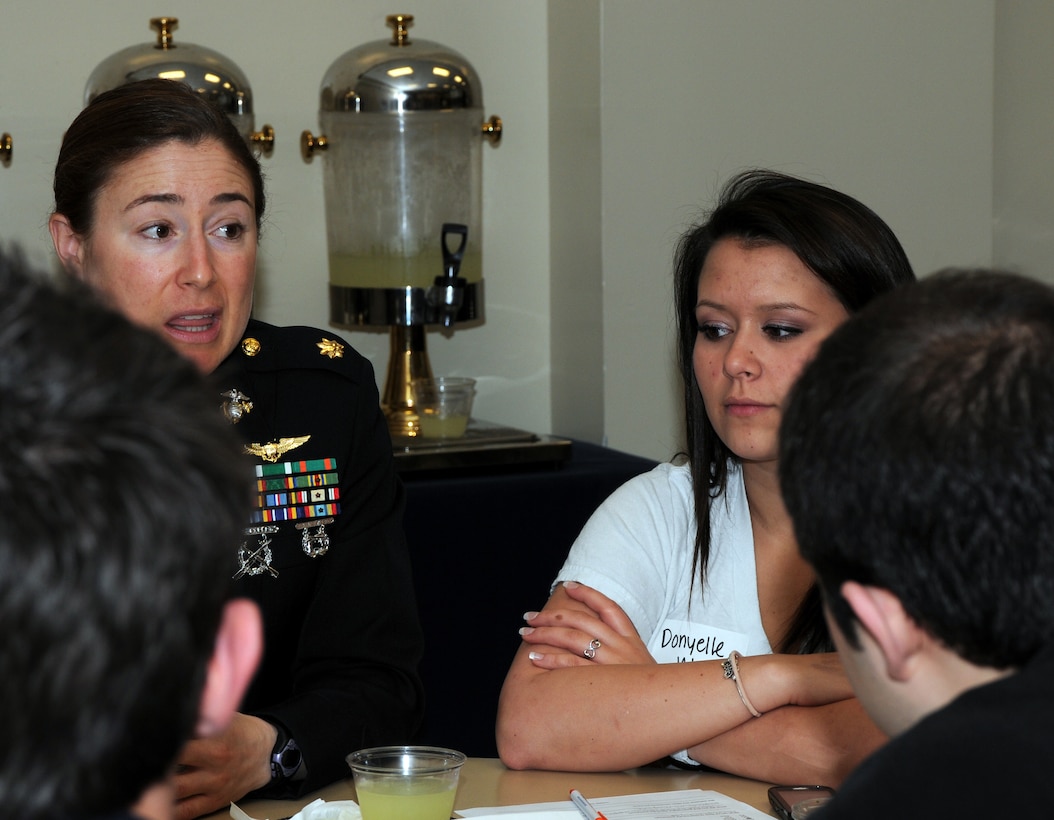 Maj. Jennifer Marino, left, a pilot with Marine Helicopter Squadron One, talks to students about the Marine Corps leadership traits and principles during a leadership workshop at the University of Texas at San Antonio. As part of a push to diversify the Corps’ officer ranks, Marine officers from all walks of Corps life came together at the University of Texas at San Antonio to teach a group of more than 80 students the Marine Corps leadership traits and principles during a two-hour leadership workshop.  (Official Marine Corps photo by Staff Sgt. Matt Epright)