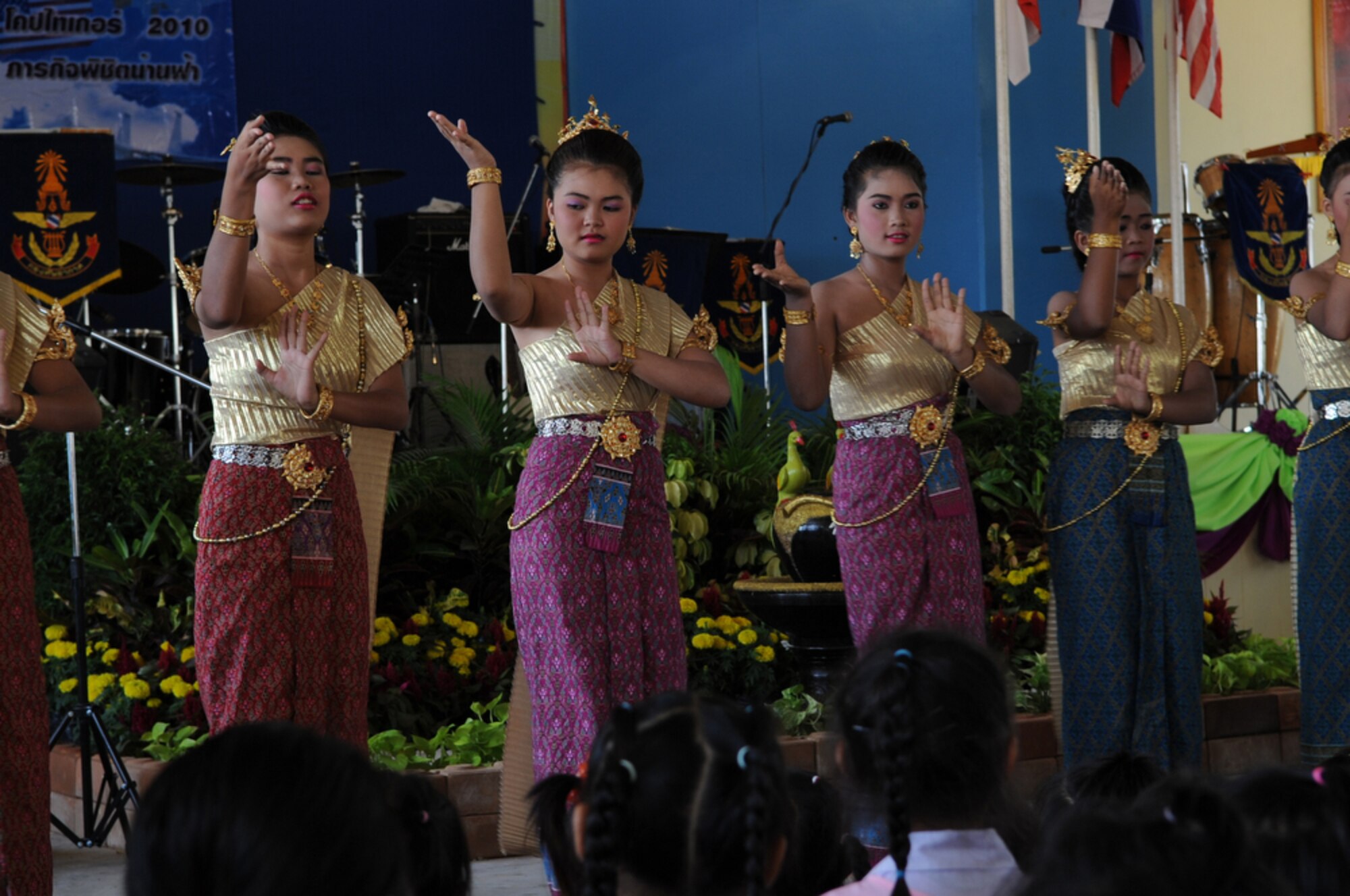 Performers at the Bau Nong Sroung School entertain onlookers during a Cope Tiger 2010 community relations event March 4.  Airmen from the U.S., Royal Thai and Republic of Singapore air forces teamed up to provide medical, dental and optometry care at the school to local residents as part of Cope Tiger 2010.  Money, school supplies, toys and games were also donated by all three air forces for the children at the school.  (U.S. Air Force photo/Tech Sgt. Cohen A. Young)