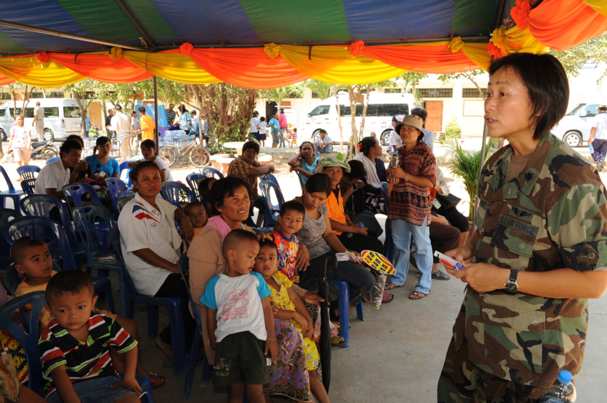 Lt. Col. Peerach Ewings talks to local Thai women and children about the importance of proper dental health and controlling their diet at Bau Nong Sroung School in Thailand during a Cope Tiger 2010 community relations event March 4.  Colonel Ewings is deployed to the exercise from 13th Air Force at Joint Base Pearl Harbor Hickam, Hawaii.  Airmen from the U.S., Royal Thai and Republic of Singapore air forces teamed up to provide medical, dental and optometry care at the school to local residents as part of Cope Tiger 2010.  Money, school supplies, toys and games were also donated by all three air forces for the children at the school.  (U.S. Air Force photo/Tech Sgt. Cohen A. Young)