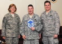 KADENA AIR BASE, Japan -- Master Sgt. Michael Frazier (center) poses for a photo with Col. John Glaze (right), the 353rd Special Operations Group deputy commander, and Chief Master Sgt. Vicki Gamble, the 353rd SOG command chief master sergeant, after being selected for promotion to senior master sergeant here March 5. (U.S. Air Force photo by Tech. Sgt. Aaron Cram)