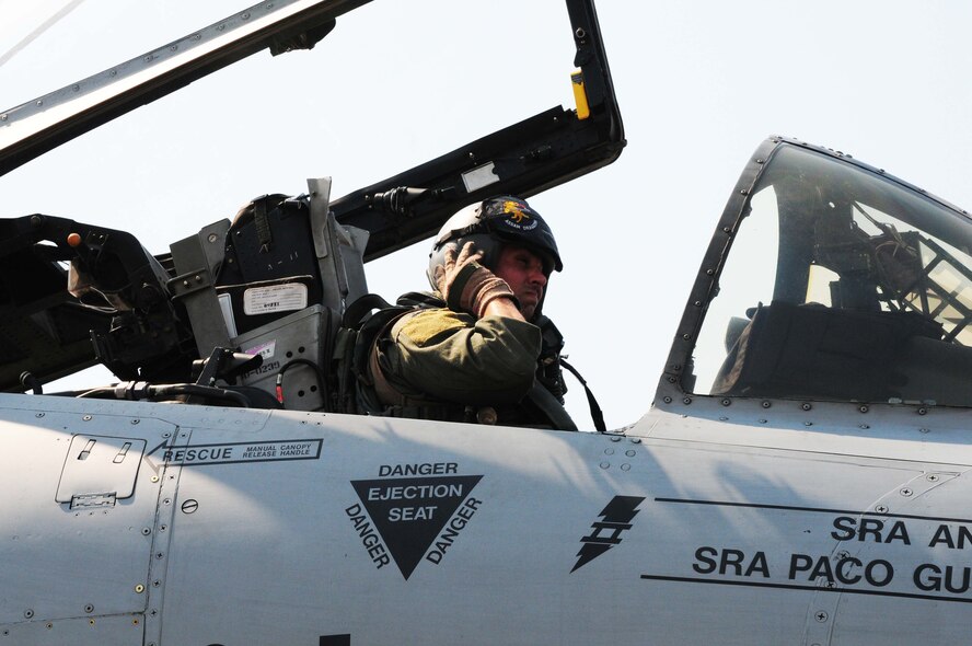 Capt. Matthew Lackey secures his helmet prior to flying the first A-10 Thunderbolt II mission of Cope Tiger 2010 at Udon Thani Royal Thai Air Force Base, Thailand, on March 4. Captain Lackey is deployed to the exercise from the 25th Fighter Squadron at Osan Air Base, South Korea.  His squadron is participating in the annual, multilateral field training exercise involving the U.S. Air Force, Royal Thai Air Force and Army, and the Republic of Singapore Air Force March 1-12.  (U.S. Air Force photo/Capt. Genieve David)
