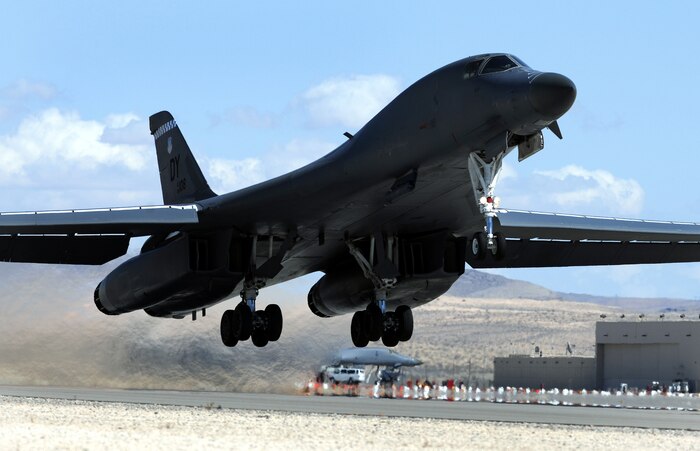 NELLIS AIR FORCE BASE, Nev. -- A B-1 Lancer assigned to 7th Operations Group, Dyess Air force base, Texas, departs for a training mission at Red Flag 10-3 March 3, 2010. Red Flag is a realistic combat training exercise involving the air forces of the United States and its allies. The exercise is conducted on the 15,000-square-mile Nevada Test and Training Range, north of Las Vegas. (U.S. Air Force photo by Airman 1st Class Brett Clashman/RELEASED)