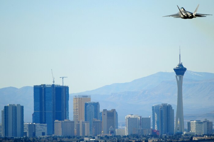 NELLIS AIR FORCE BASE, NEV. -- An F-22 Raptor takes off from the Nellis flight line during a Red Flag Exercise, March 3, 2010. Red Flag is a realistic combat training exercise involving the air forces of the United States and its allies. The exercise is conducted on the 15,000-square-mile Nevada Test and Training Range, north of Las Vegas.   (U.S. Air Force Photo by Staff Sgt. William P. Coleman/RELEASED)