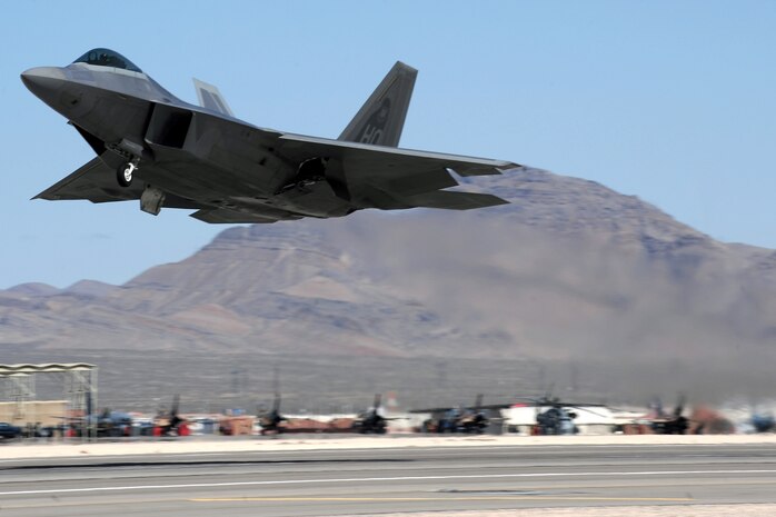 NELLIS AIR FORCE BASE, Nev. --  A F-22, from Holloman AFB, N.M. takes off from the Nellis flightline for a training mission during Red Flag 10-3 March 3, 2010. Red Flag is a realistic combat training exercise involving the air forces of the United States and its allies. The exercise is conducted on the 15,000-square-mile Nevada Test and Training Range, north of Las Vegas. (U.S. Air Force photo by Tech. Sgt. Michael R. Holzworth/RELEASED)