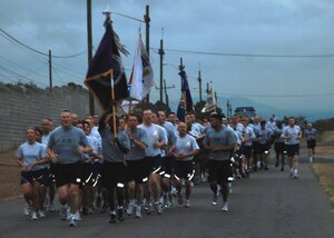 Soldiers, Sailors, Airmen and Marine participate in a morning formation run around Soto Cano Air Base, Honduras, March 4. Army Col. Gregory Reilly, Joint Task Force-Bravo commander, led all of Team Soto Cano in the formation run designed to build unit cohesion and esprit de corps. (U.S. Air Force photo by 1st Lt. Jennifer Richard)
