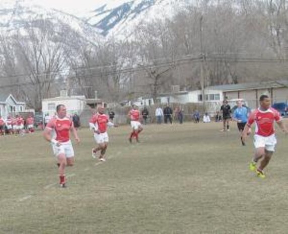 Staff Sgt. Dustin Ballingham (left) sets up in a defensive role to support teammate "Pauly," who is wearing yellow cleats, in Division I League play as the Northside Tigers faced off against the Samoan Islanders in a game held Feb. 27 in Provo. The Islanders won, 10-13, in a competitive, well played game. 