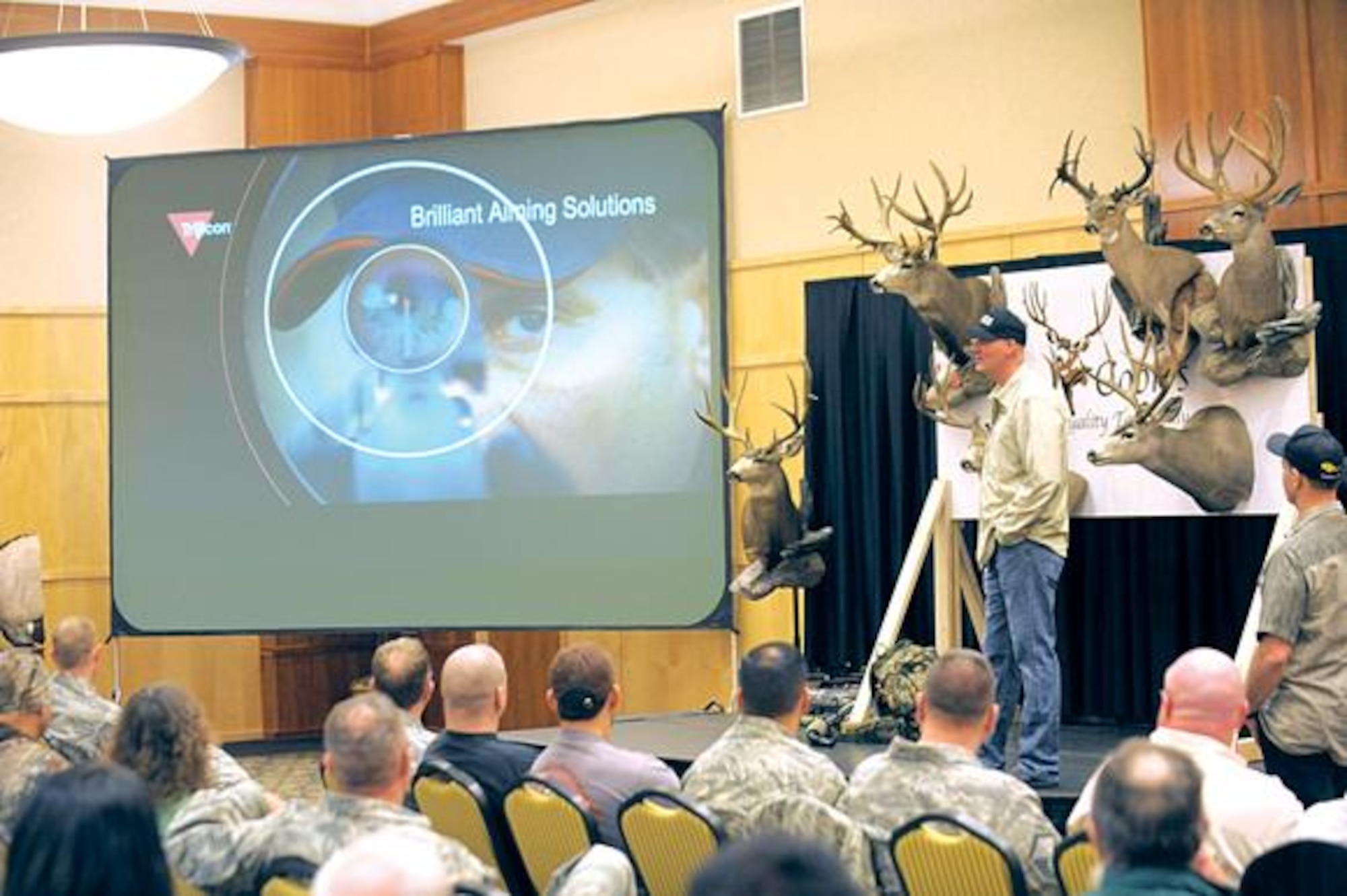 Jim Burnworth of the cable show, "Western Extreme," talks and takes questions at the Western Extreme symposium held at Club Hill on Feb. 25. The Outdoor Channel show host was visiting Hill Air Force Base to film interviews with Airmen and others for broadcast on his show later this year.