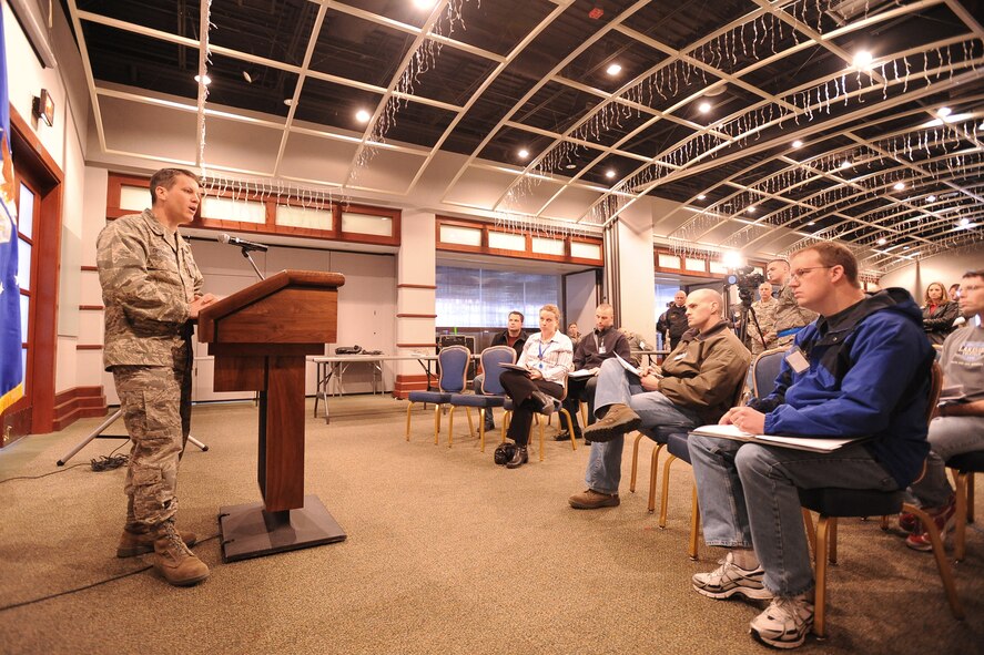 Colonel Jamie Crowhurst, 22nd Air Refueling Wing commander, answers questions from “media representatives” at a mock press conference, Feb. 24, 2010, during an emergency management inspection exercise at McConnell Air Force Base, Kan. The media representatives, who were played by Air Mobility Command inspectors, asked about a simulated explosion that occurred earlier in the day. The EMI was designed to assess the base’s ability to respond to a major emergency. (U.S. Air Force photo/Staff Sgt. Jamie Train)