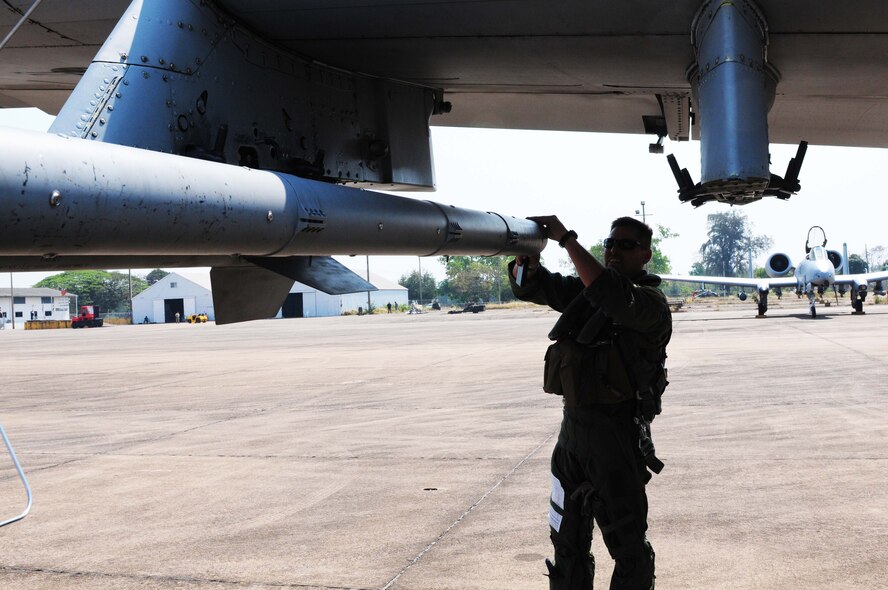 Capt. Matthew Lackey conducts an exterior inspection of an A-10 Thunderbolt II prior to flying the first A-10 mission of Cope Tiger 2010 at Udon Thani Royal Thai Air Force Base, Thailand, on March 4. Captain Lackey is deployed to the exercise from the 25th Fighter Squadron at Osan Air Base, South Korea.  His squadron is participating in the annual, multilateral field training exercise involving the U.S. Air Force, Royal Thai Air Force and Army, and the Republic of Singapore Air Force March 1-12.  (U.S. Air Force photo/Capt. Genieve David)