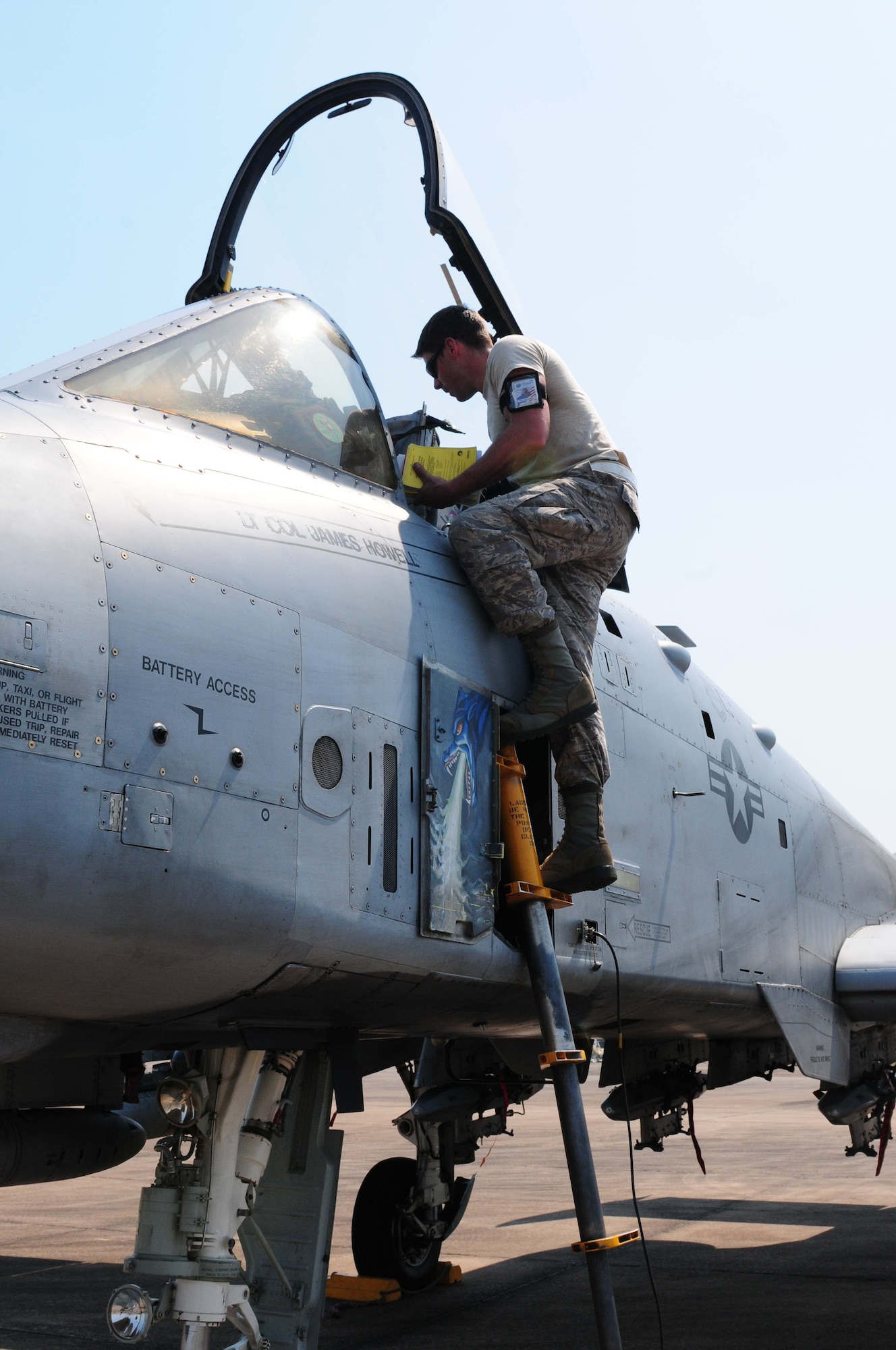 Senior Airman Graeme Clark prepares the cockpit of an A-10 Thunderbolt II March 4 for pilots participating in Cope Tiger 2010 at Udon Thani Royal Thai Air Force Base, Thailand.  Airman Clark is deployed to the exercise from Osan Air Base, South Korea.  Airmen from Osan are participating in the annual, multilateral field training exercise involving the U.S. Air Force, Royal Thai Air Force and Army, and the Republic of Singapore Air Force March 1-12.  (U.S. Air Force photo/Capt. Genieve David)