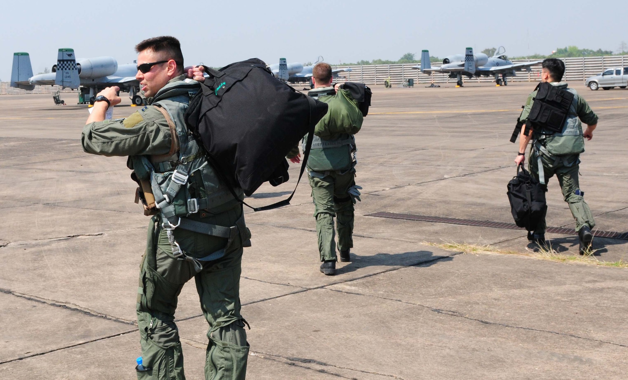 Airmen from the 25th Fighter Squadron at Osan Air Base, South Korea, walk to their aircraft at Udon Thani Royal Thai Air Force Base, Thailand, March 4 before conducting the first of several planned missions as part of Cope Tiger 2010.  The Airmen are participating in the annual, multilateral field training exercise involving the U.S. Air Force, Royal Thai Air Force and Army, and the Republic of Singapore Air Force March 1-12.  (U.S. Air Force photo/Capt. Genieve David)