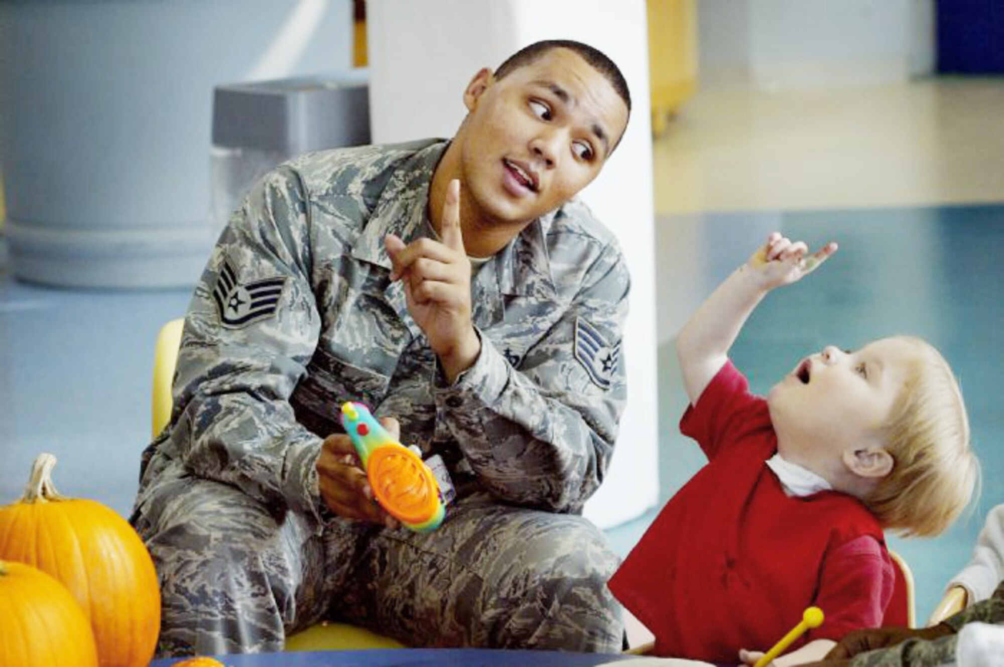 Staff Sgt. Jewell Hicks interacts with a child at Ranken Jordan Pediatric Hospital, Ill. Sergeant Hicks is now an imagery analyst assigned to the 13th Intelligence Squadron at Beale Air Force Base, Calif. (Courtesy photo)
