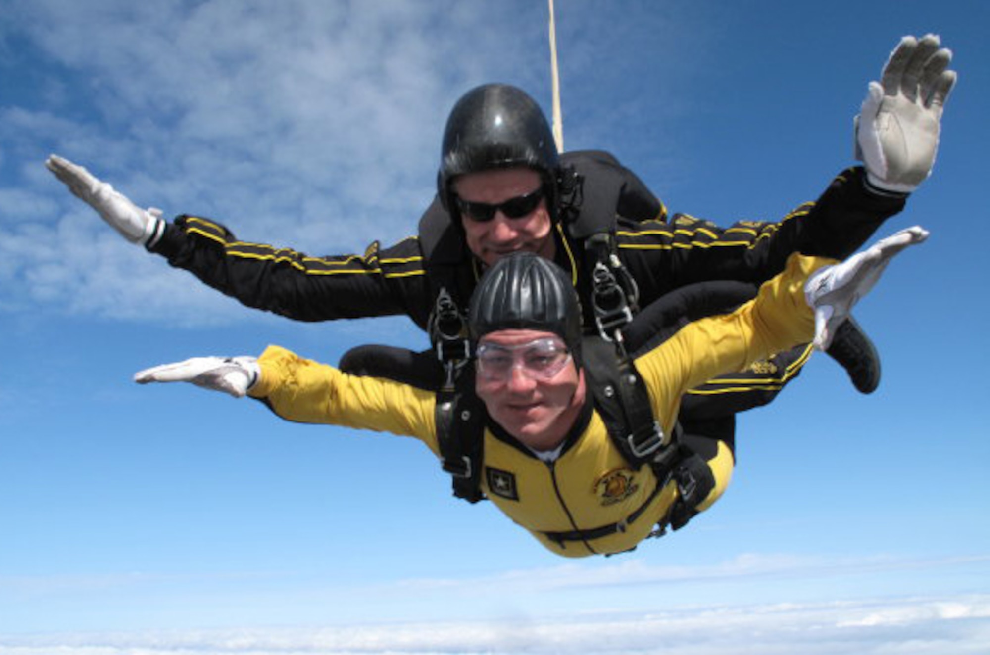 Master Sgt. Daniel Lawlor, a reservist with the 42nd Aerial Port Squadron, free falls with a US Army Golden Knights parachutist over Florida. (photo courtesy of the Golden Knights)