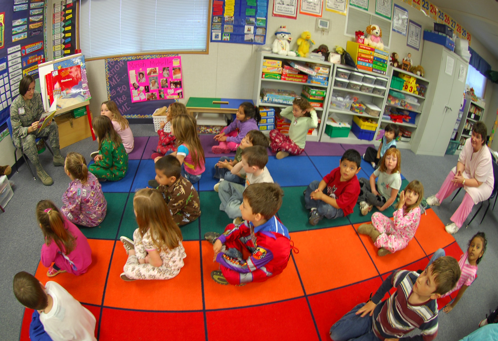 Airman Hayley Lambert, from the 9th Communication Squadron, reads a Dr. Suess book to children at Arboga Elementary School Mar. 2. Airman Lambert took part in a nationwide event Read Across America, which happens around Dr. Suess’s birthday. (U.S. Air Force photo/ Senior Airman Kevin Iinuma)
