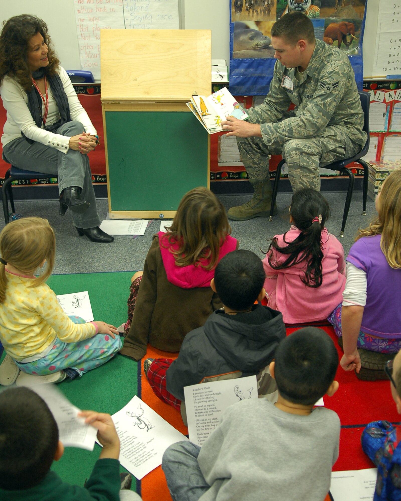 Airman 1st Class Timothy Clingan, from the 9th Communications Squadron, reads aloud to children at Arboga Elementary School Mar. 2.  Airman Clingan volunteered his time for the Read across America event, sponsored by the National Education Association. (U.S. Air Force photo/ Senior Airman Kevin Iinuma)