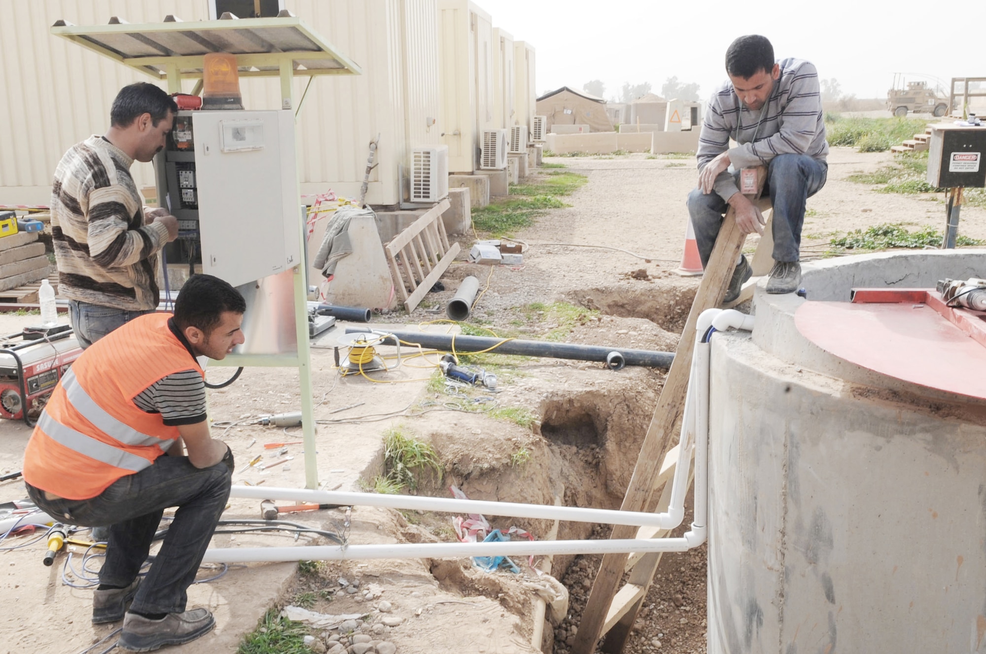 Crew members of Black Gold Holding Company build a new lift station Feb. 24, 2010 at Kirkuk Air Base, Iraq. (U.S. Air Force photo/Staff Sgt. Tabitha Kuykendall)
