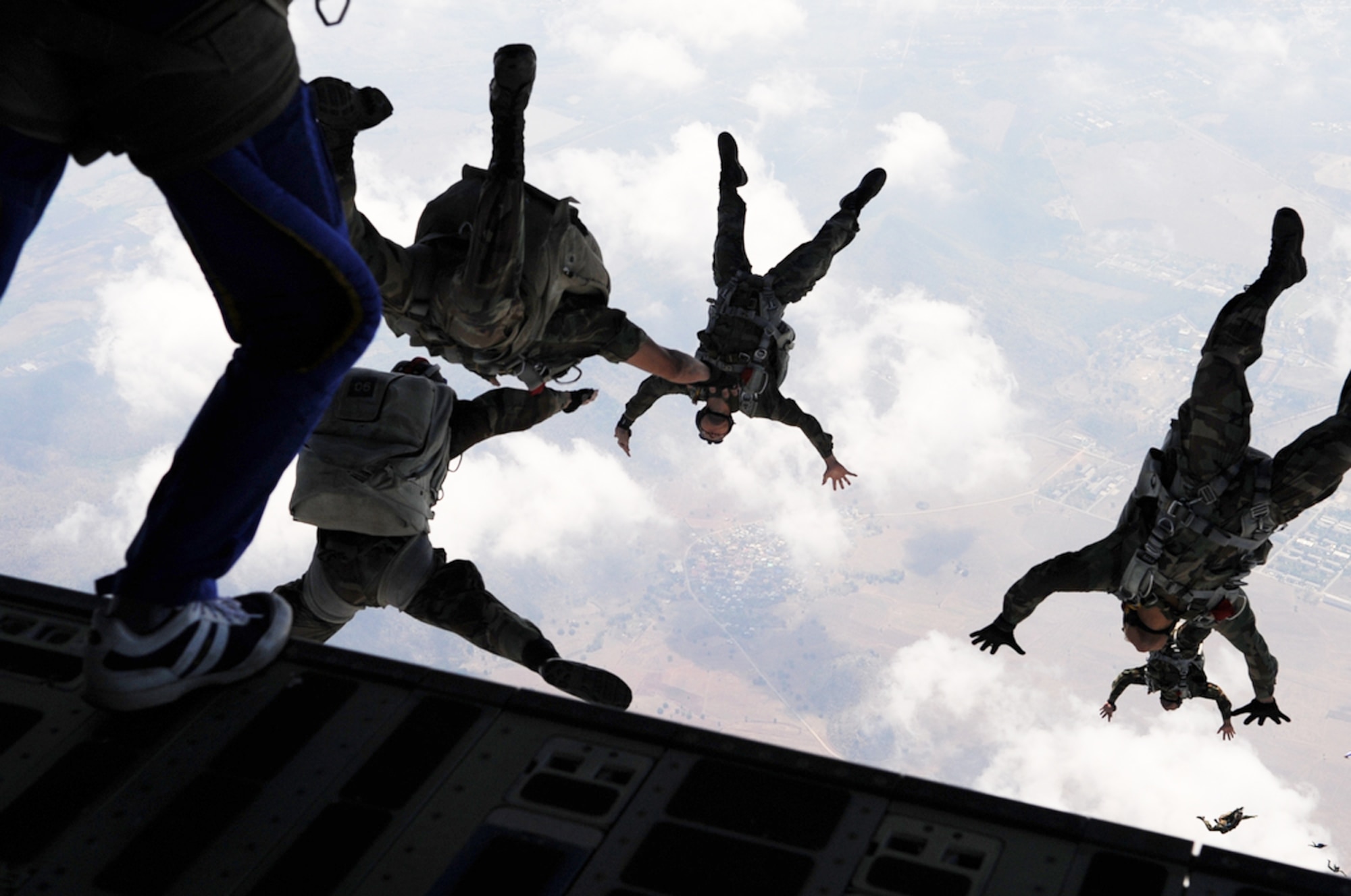 U.S. Air Force and Royal Thai Air Force parachute team members jump from the back of a C-17 Globemaster III during Cope Tiger 2010 March 3, 2010 at Dom Muang Royal Thai Air Force Base, Thailand. (U.S. Air Force photo/Tech. Sgt. Cohen A. Young)
