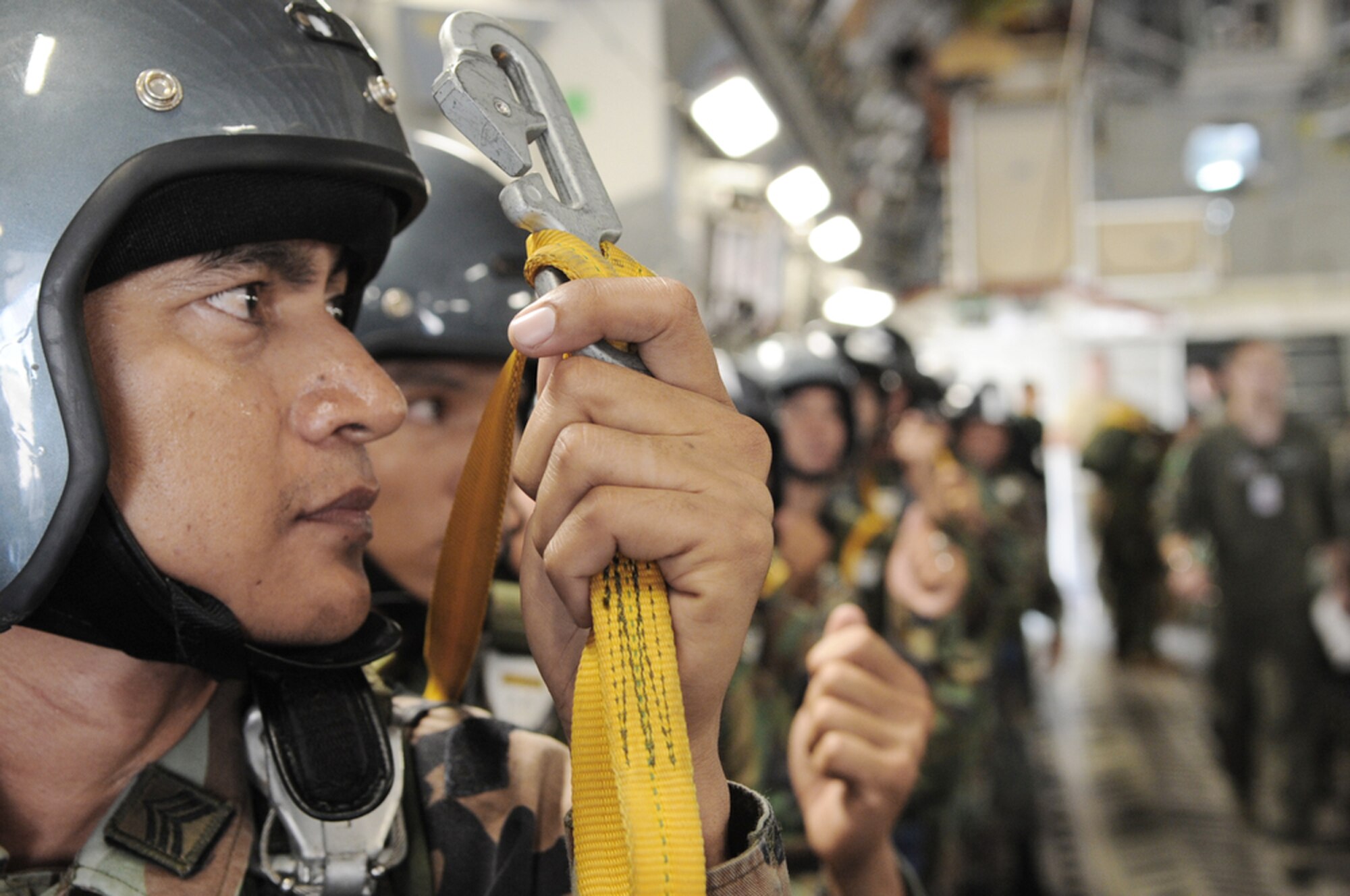 A member of the Royal Thai Air Force Parachute Team gets ready for his 10,000-foot static-line jump from a C-17 Globemaster III during Cope Tiger 2010 at Dom Muang Royal Thai Air Force Base, Thailand, March 3, 2010. Cope Tiger is a multilateral, combined and joint command post and field training exercise involving the United States, Thailand and Singapore. The exercise takes place March 1-12. (U.S. Air Force photo/Tech. Sgt. Cohen A. Young)