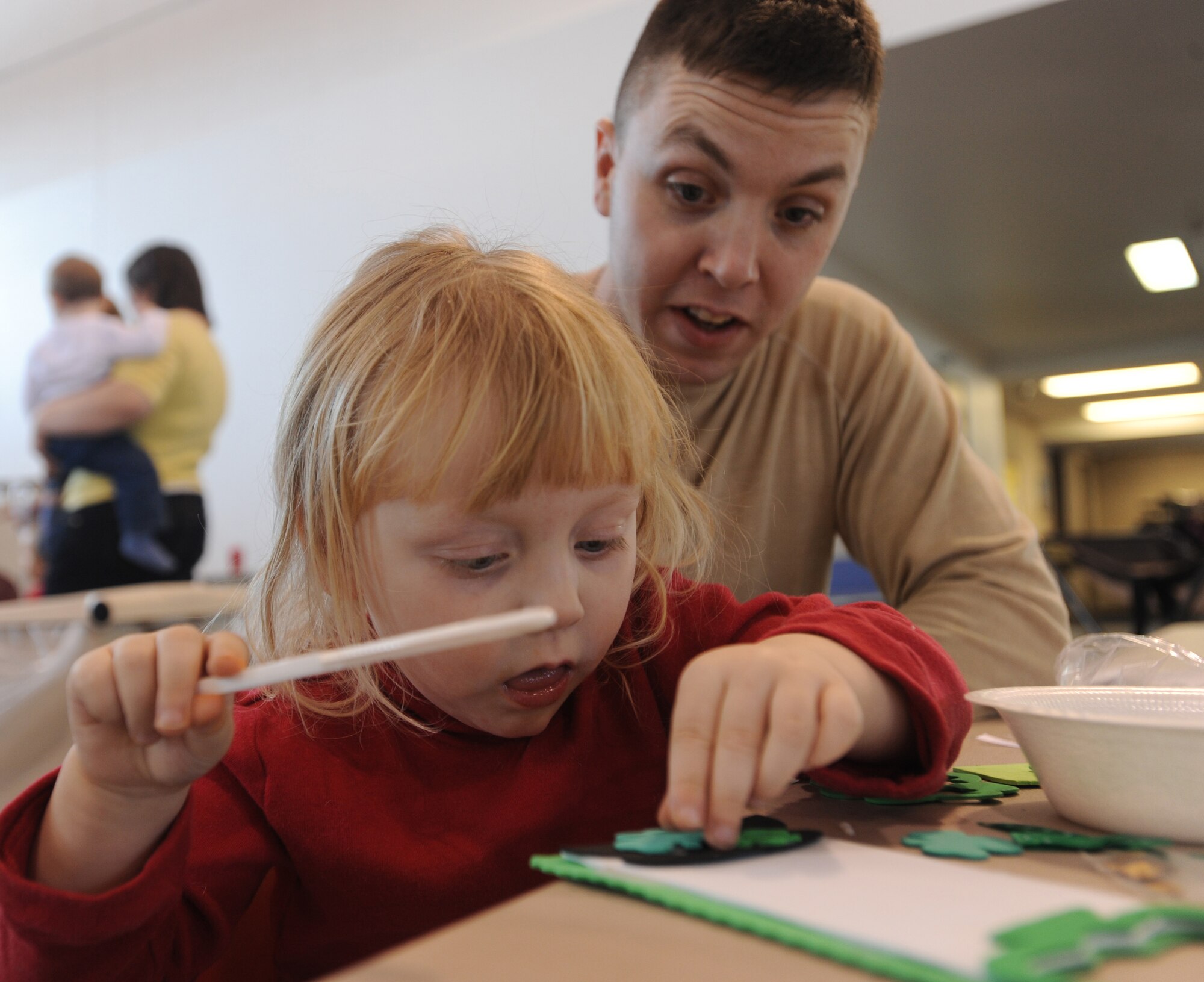 Callie Peperissa and her dad, Staff Sgt. Eric Peperissa, 319th Civil Engineer Squadron, work on arts and crafts Feb. 25 during the 2010 Winter Bash at Grand Forks Air Force Base, N.D. The Winter Bash was created to increase esprit-de-corps and allow Airmen to take a break from their day to day work environments. The wing also holds a Summer Bash in August. (U.S. Air Force photo by Staff Sgt. Suellyn F. Nuckolls)