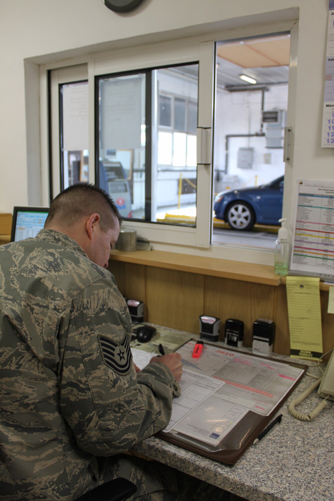 U.S. Air Force Staff Sgt. Emry Jerry, 86th Vehicle Readiness Squadron completes the safety inspection record, Feb. 11, 2010, Kapaun Air Station. The inspection center inspects more than 30,000 vehicles each year. (Courtesy photo)