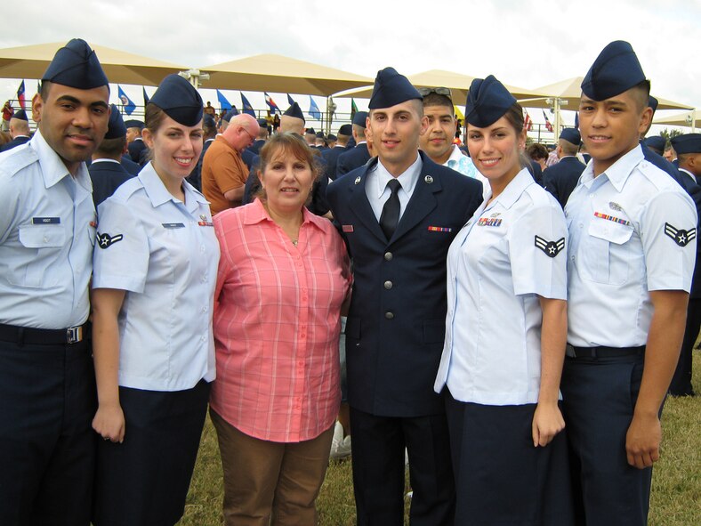 The Boeninghaus clan poses for a photo after the graduation ceremony of Airman 1st Class Jason Boeninghaus. The three siblings all came together at Dover Air Force Base and together form a very strong family bond. (U.S Air Force photo/Courtesy photo)