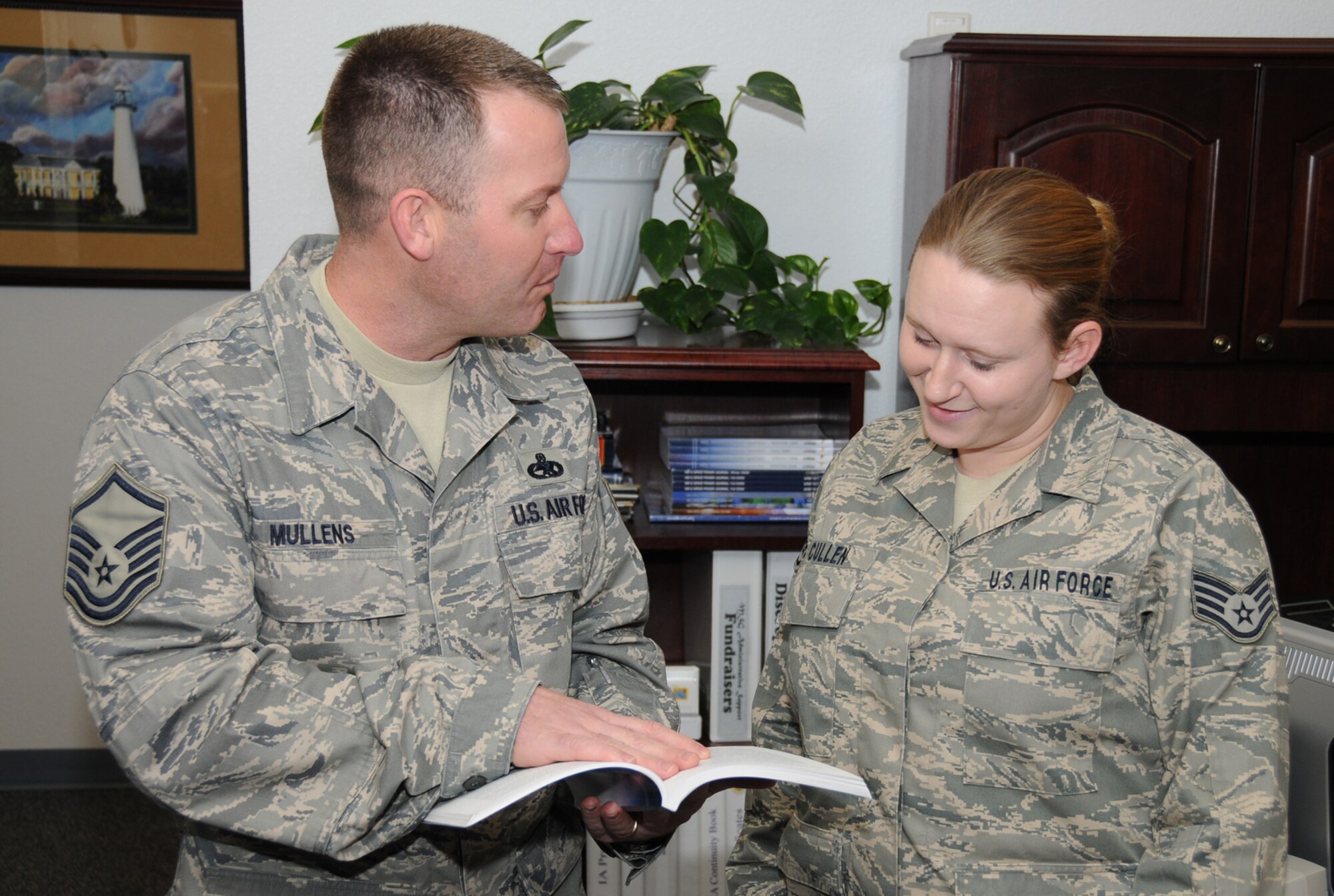 Master Sgt. Steven Mullens, 81st Force Support Squadron, discusses the retraining window with Staff Sgt. April Cullen, 81st Mission Support Group.  (U.S. Air Force photo by Kemberly Groue)