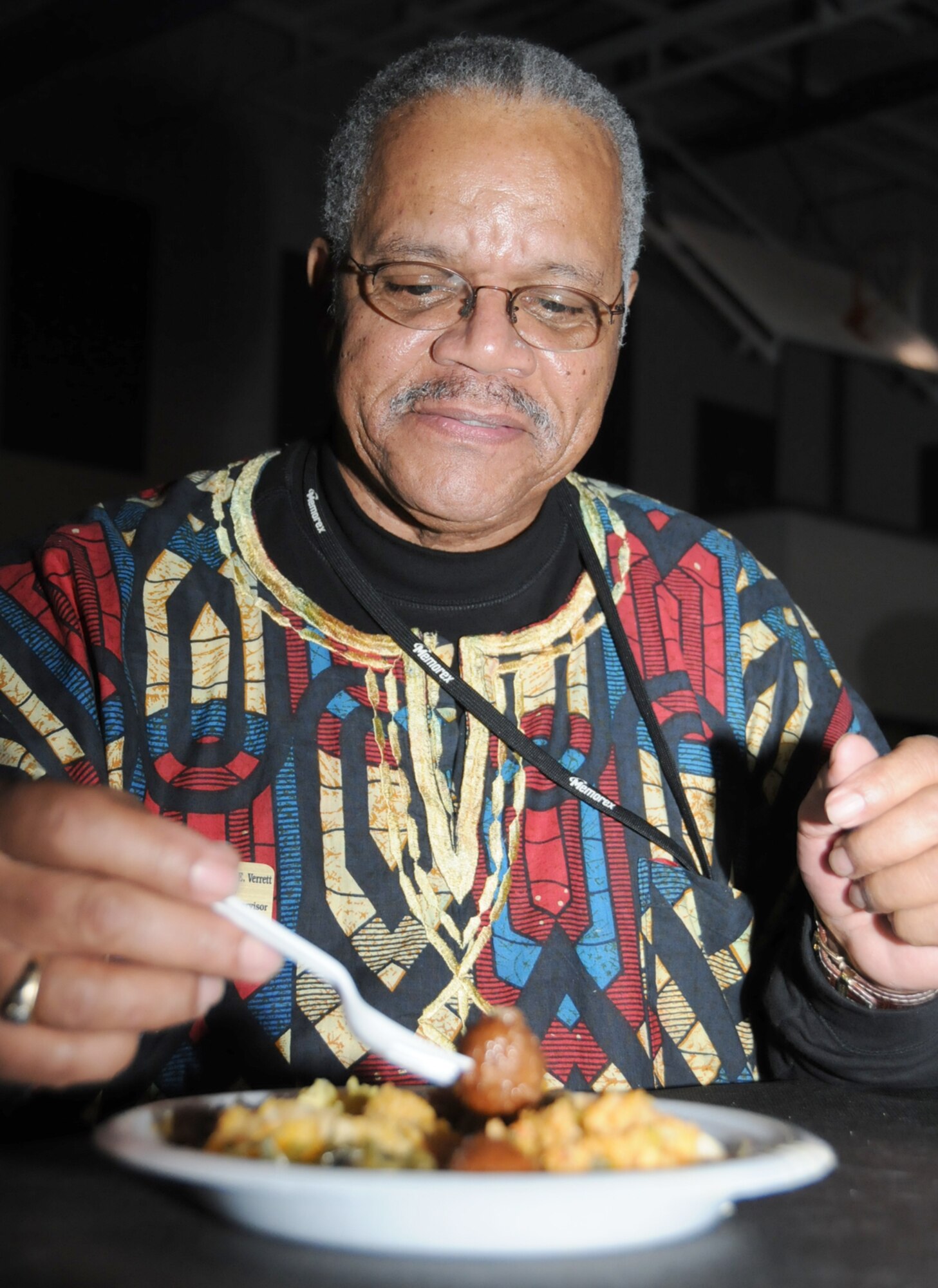 Alexander Verrett, 338th TRS, enjoys a plate full of soul food selections.  The African-American Heritage Committee sponsored the event.  (U.S. Air Force photo by Kemberly Groue)