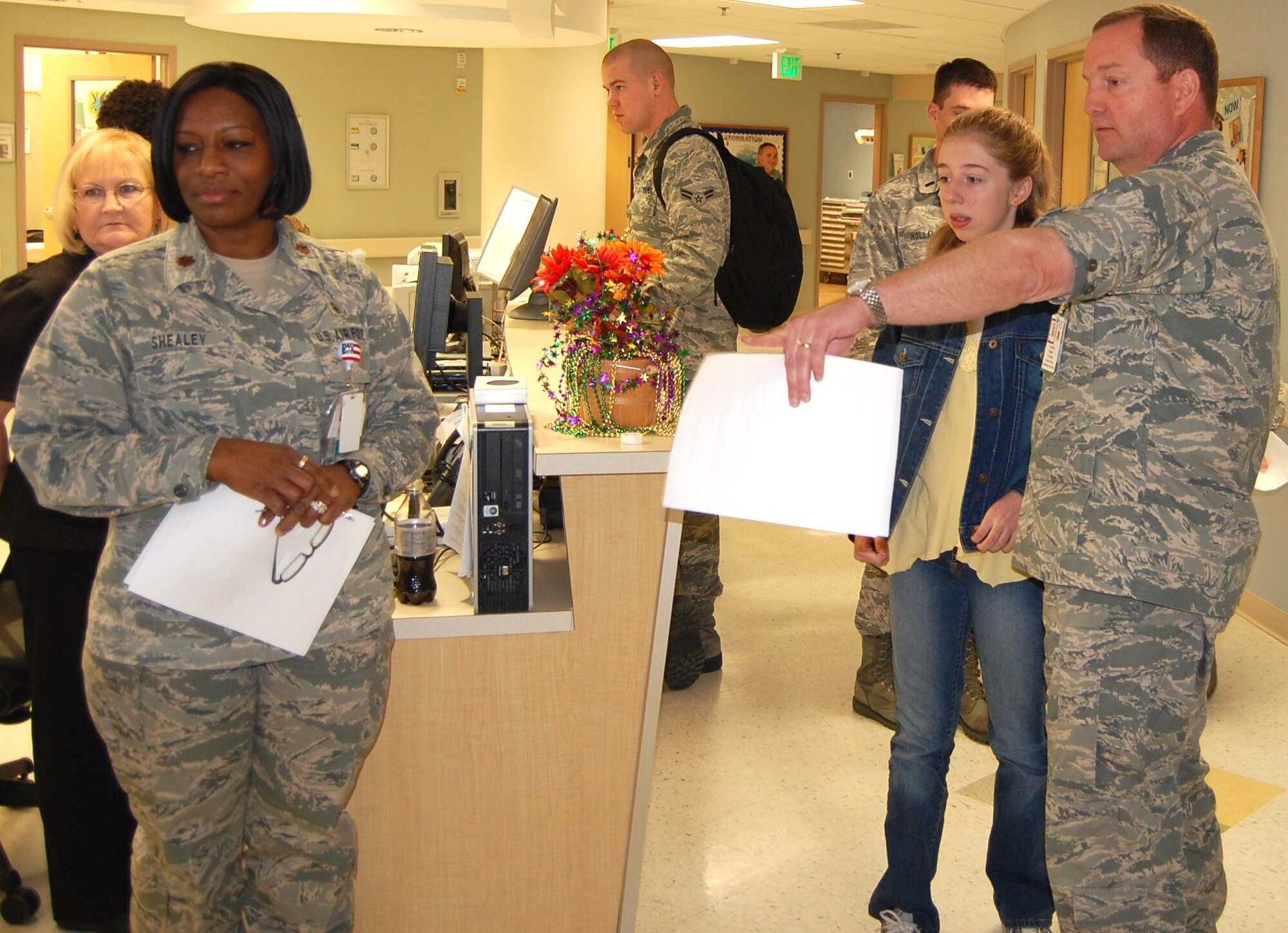 Col. Robert Cothron, 81st Medical Group administrator, gives a tour of the 81st Medical Group’s family birthing center to daughter Jodi, 13, a seventh grader at Ocean Springs Middle School. Maj. Janice Shealey, left, 81st Inpatient Operations Squadron maternal child flight commander, stands by to answer questions. Jodi, who visited the hospital Feb. 18 as part of a job-shadowing career discovery class assignment, also helped evaluate a Code Pink infant/child abduction exercise, watched a medical simulation in the training lab and received a coin from Air Education and Training Vice Commander Maj. Gen. Anthony Przybyslawski, for whom the simulation was conducted.  (U.S. Air Force photo by Steve Pivnick)