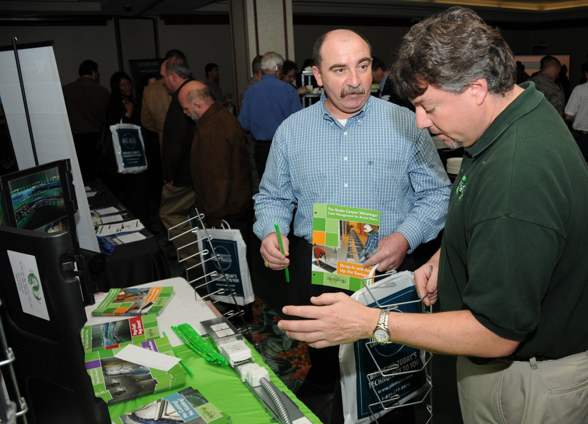 Arlen Fountain, left, 81st Medical Support Squadron, chats with Scott Jacobitti, national sales manager for Cable Management Solutions, during the Keesler Information Technology Expo Feb. 23 at the IP Casino Resort in Biloxi.  The free event, sponsored by the 81st Training Support Squadron’s training and technology flight in conjunction with the Gulf Coast Chapter of the Armed Forces Communications and Electronics Association, featured the latest in training and information support technology and an opportunity to talk with industry representatives about how their products and services could benefit Keesler’s mission.  (U.S. Air Force photo by Kemberly Groue)