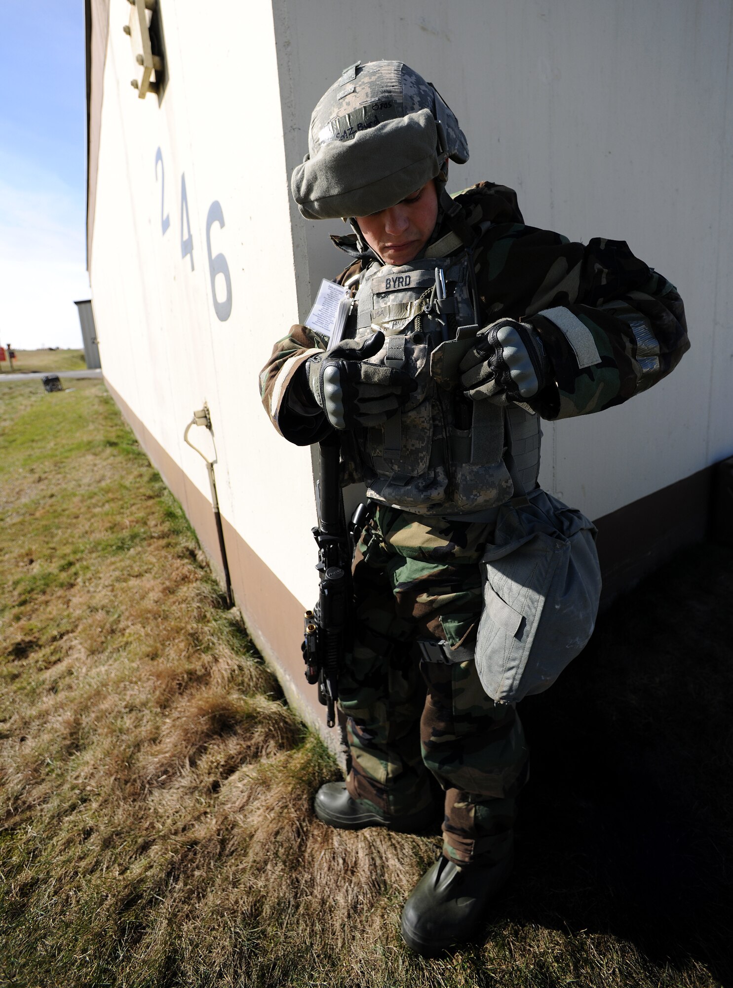 SPANGDAHLEM AIR BASE, Germany – Senior Airman Zachary Byrd, 52nd Security Forces Squadron, prepares to search the body of an enemy infiltrator after simulating use of deadly force to prevent the infiltrator from further breaching the perimeter on the flightline March 3. Members of the 52nd Fighter Wing participated in Operation Saber Crown 10-04 to evaluate the wing’s ability to operate in a chemical, biological, radiological, nuclear and explosive environment and to prepare the wing for the NATO force evaluation this summer. (U.S. Air Force photo/Senior Airman Nathanael Callon)