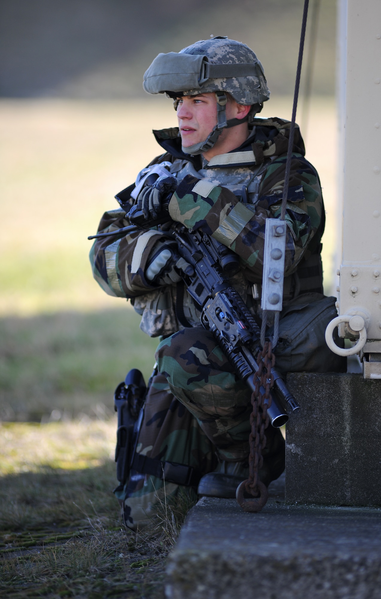 SPANGDAHLEM AIR BASE, Germany – Senior Airman Zachary Byrd, 52nd Security Forces Squadron, communicates with other 52nd SFS members after reports of simulated sniper fire prompted security action on the flightline March 3. Members of the 52nd Fighter Wing participated in Operation Saber Crown 10-04 to evaluate the wing’s ability to operate in a chemical, biological, radiological, nuclear and explosive environment and to prepare the wing for the NATO force evaluation this summer. (U.S. Air Force photo/Senior Airman Nathanael Callon)