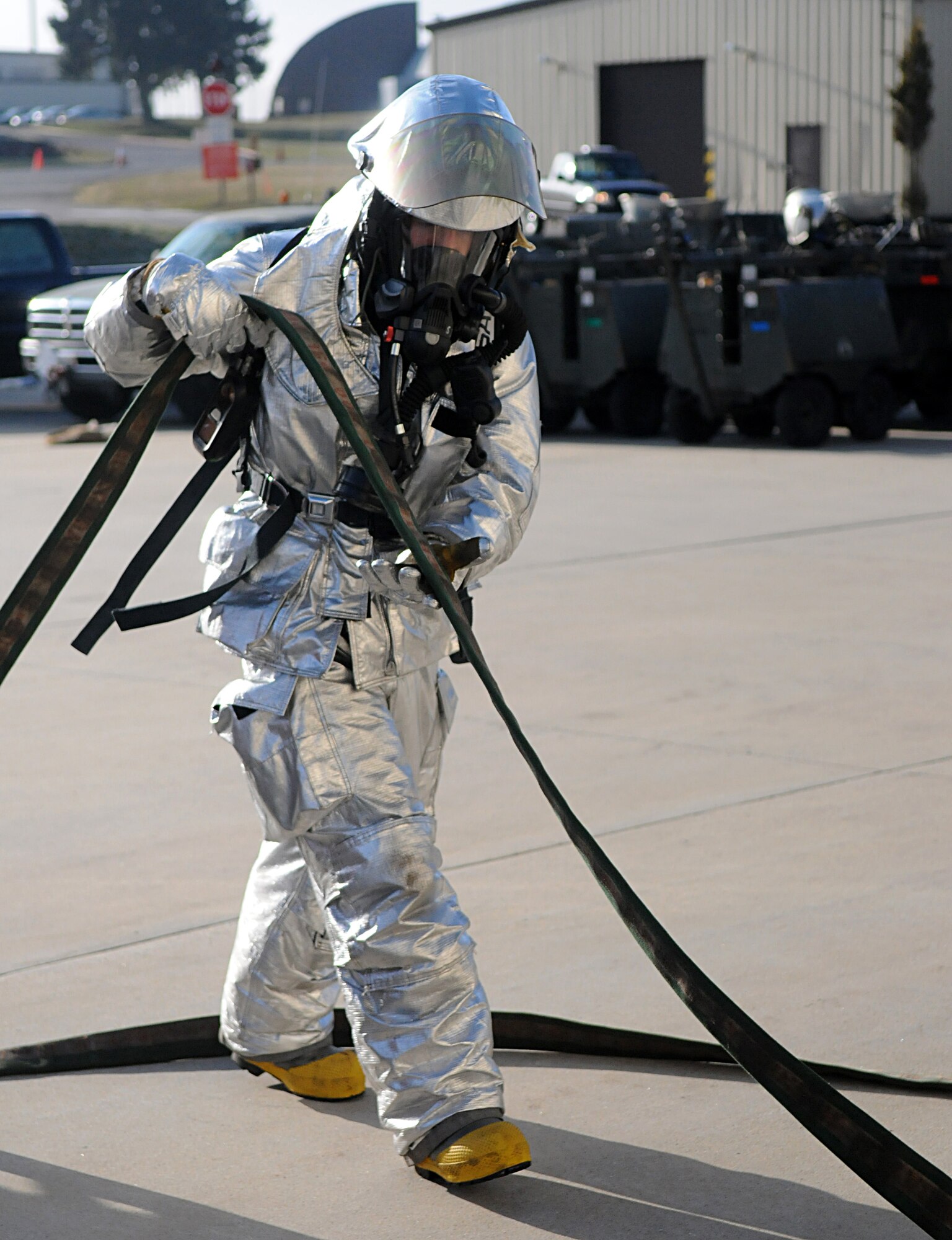 SPANGDAHLEM AIR BASE, Germany – A 52nd Civil Engineer Squadron firefigher, responds to a simulated fire during Operation Saber Crown 10-04 March 3. The Phase II exercise evaluated the wing’s self-aid and buddy care execution, emergency response and chemical, biological, radiological, nuclear and explosive procedures to prepare for the upcoming NATO force evaluation. (U.S. Air Force photo/Airman 1st Class Staci Miller) 