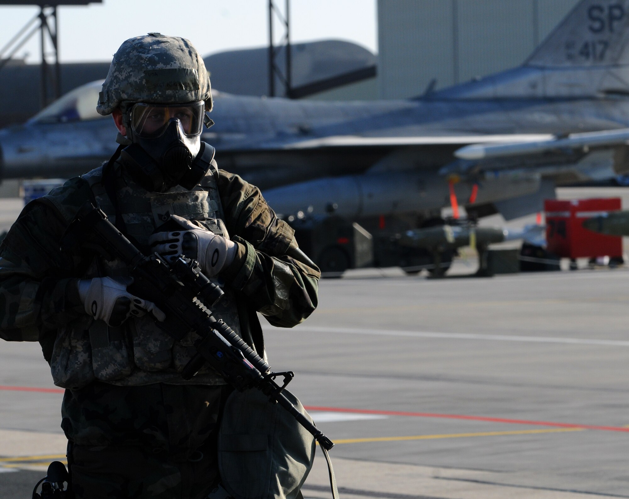 SPANGDAHLEM AIR BASE, Germany – Staff Sgt. Donald McKenzie, 52nd Security Forces Squadron, secures a portion of the flightline after a simulated mortar attack during Operation Saber Crown 10-04 here March 3. Members of the 52nd Fighter Wing participated in the Phase II exercise to evaluate the wing’s ability to operate in a chemical, biological, radiological, nuclear and explosive environment and to prepare the wing for the NATO force evaluation this summer. (U.S. Air Force photo/Senior Airman Nathanael Callon)